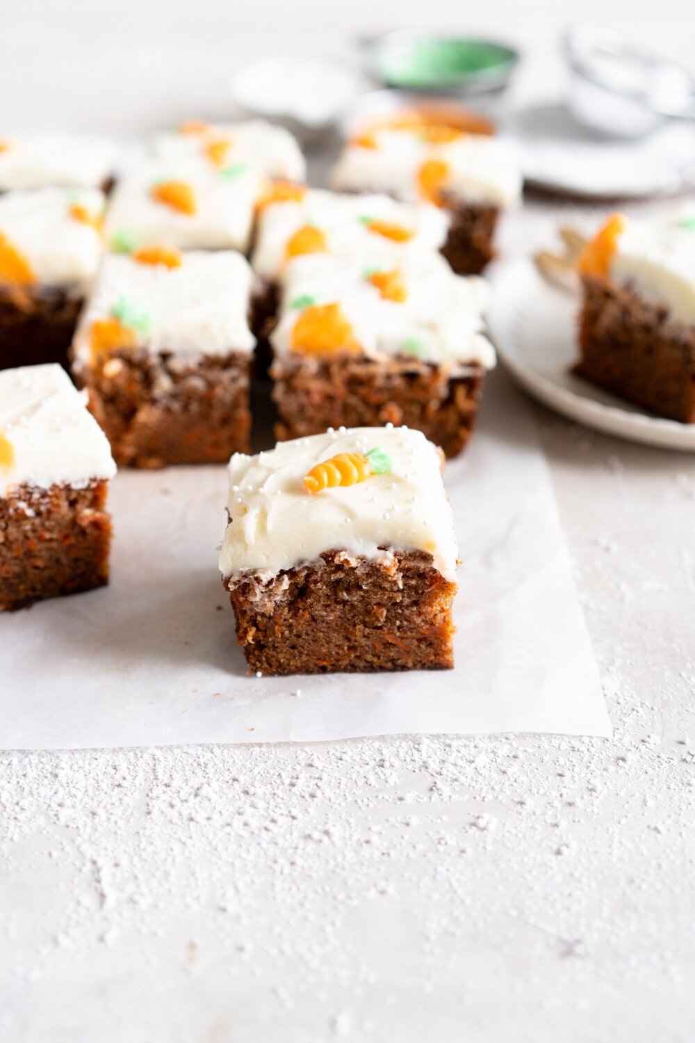 Carrot Snack Cake with Cream Cheese Frosting. This easy, moist, carrot sheet cake is the most perfect easter cake. It is made with pantry staples and finished with a simple cream cheese frosting and some super cute piped frosting carrots. This cake is great for a simple easter dessert, or for entertaining, as sheet cakes are super easy to transport.