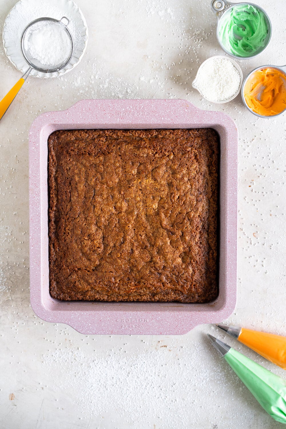 Carrot Snack Cake with Cream Cheese Frosting. This easy, moist, carrot sheet cake is the most perfect easter cake. It is made with pantry staples and finished with a simple cream cheese frosting and some super cute piped frosting carrots. This cake is great for a simple easter dessert, or for entertaining, as sheet cakes are super easy to transport.