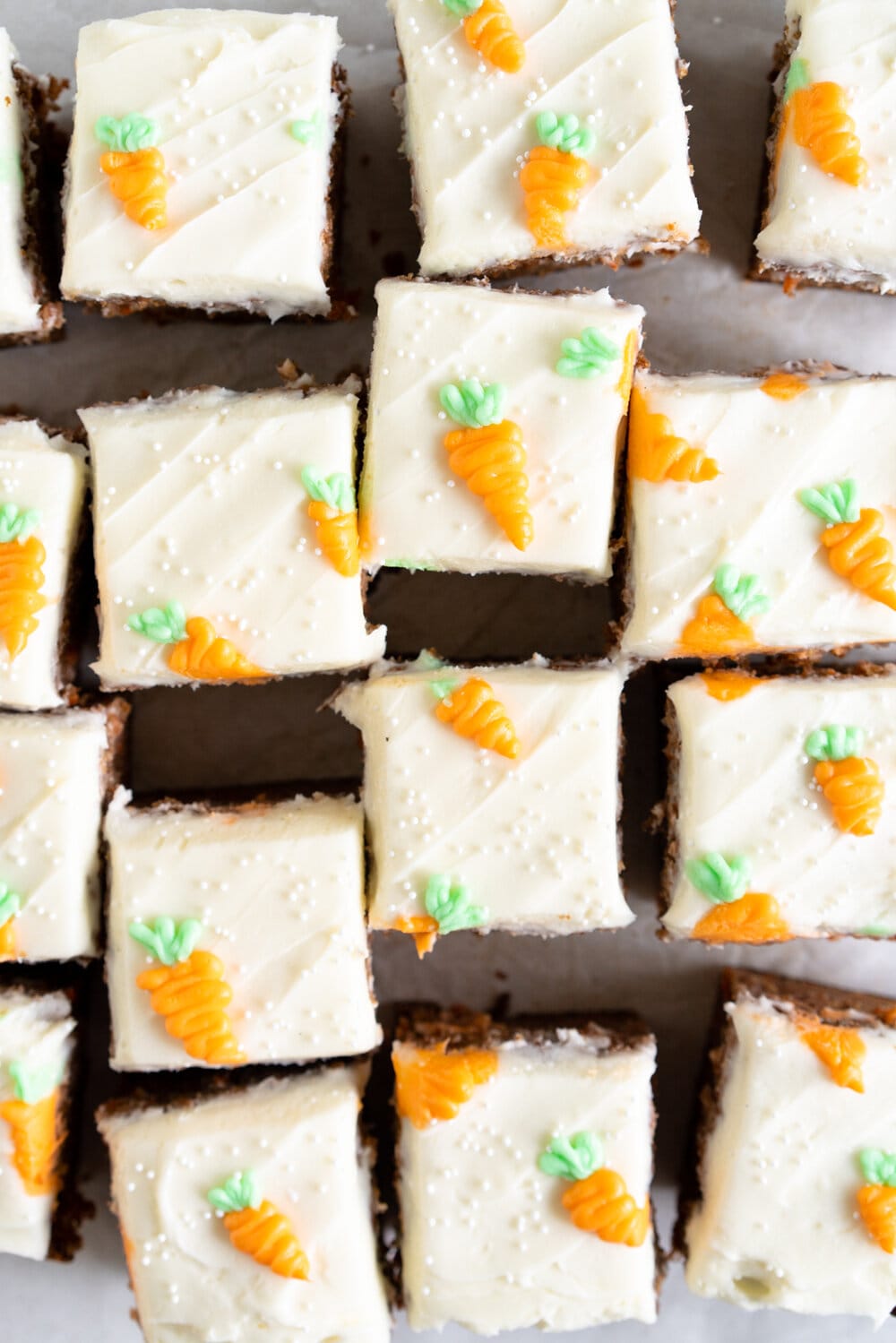 Carrot Snack Cake with Cream Cheese Frosting. This easy, moist, carrot sheet cake is the most perfect easter cake. It is made with pantry staples and finished with a simple cream cheese frosting and some super cute piped frosting carrots. This cake is great for a simple easter dessert, or for entertaining, as sheet cakes are super easy to transport.