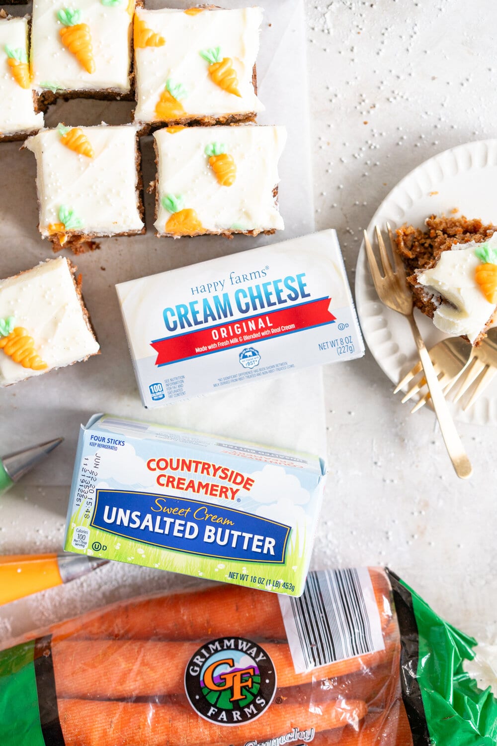 Carrot Snack Cake with Cream Cheese Frosting. This easy, moist, carrot sheet cake is the most perfect easter cake. It is made with pantry staples and finished with a simple cream cheese frosting and some super cute piped frosting carrots. This cake is great for a simple easter dessert, or for entertaining, as sheet cakes are super easy to transport.