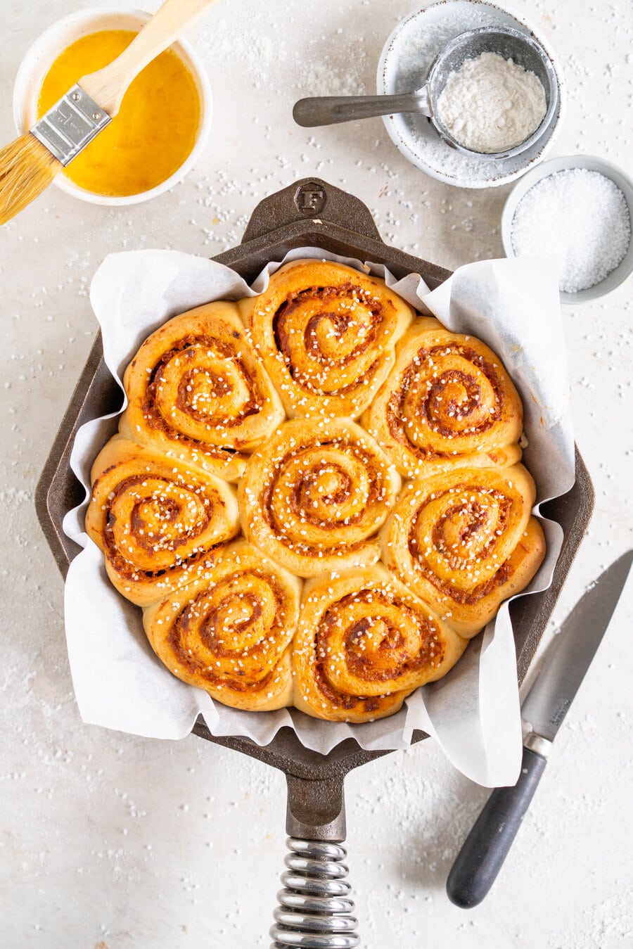 Tomato and Ricotta Pesto pull-apart buns. This easy bread dough has no eggs and no butter, making it the perfect easy dough. It is rolled out and filled with a tomato and ricotta pesto mixture and parmesan cheese, then rolled up and cut into buns and baked into perfect pull apart buns. These buns are great alongside a soup or as a delicious easy snack.