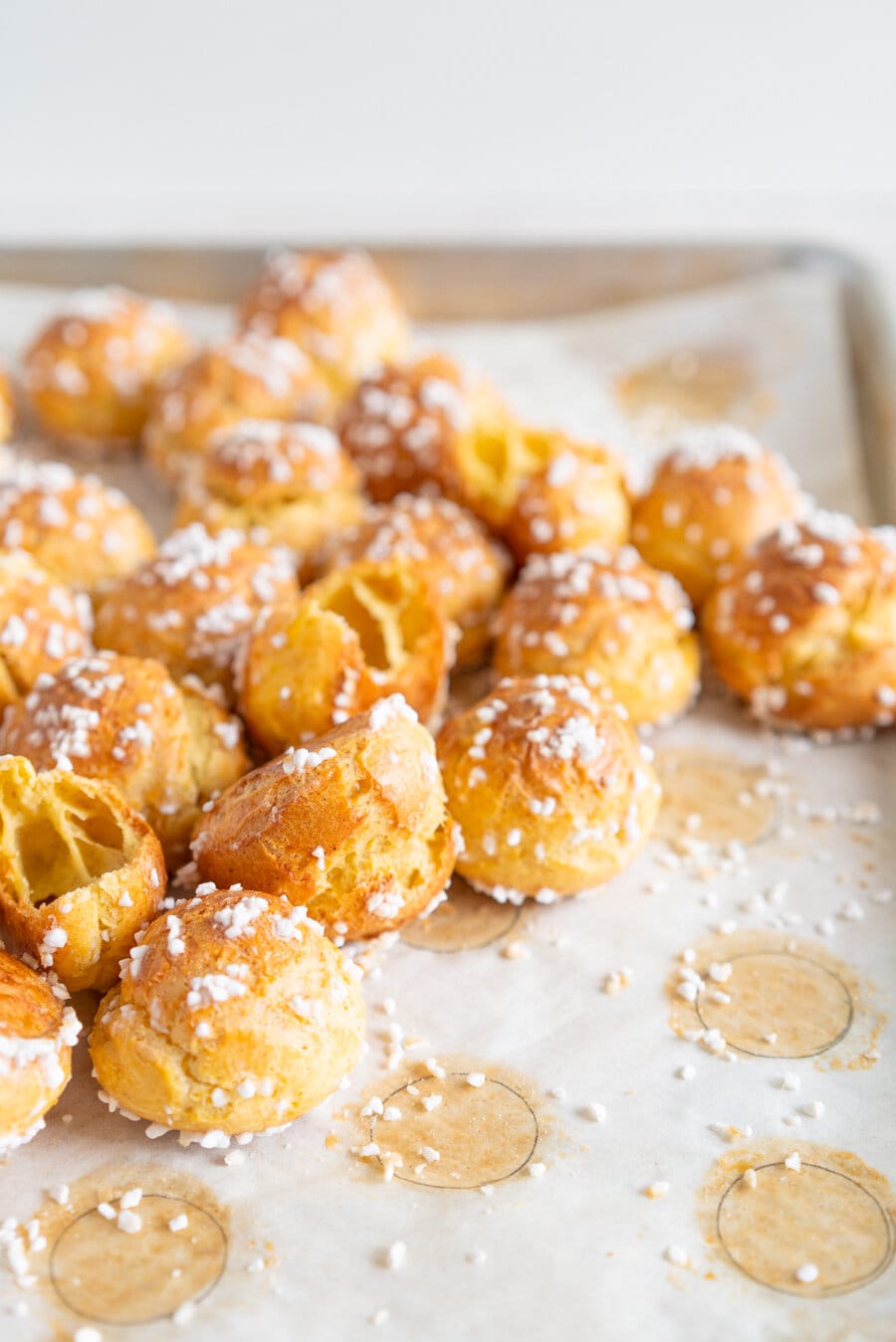 Brown Butter Chouquettes. Chouquettes are little choux pastry bites, piped into rounds and finished with pearl sugar before being baked to golden perfection. Choux is easy to make and is easy to freeze, making these the perfect treat. Brown butter choux has a delicious depth of flavour and is a perfect easy twist on a classic.