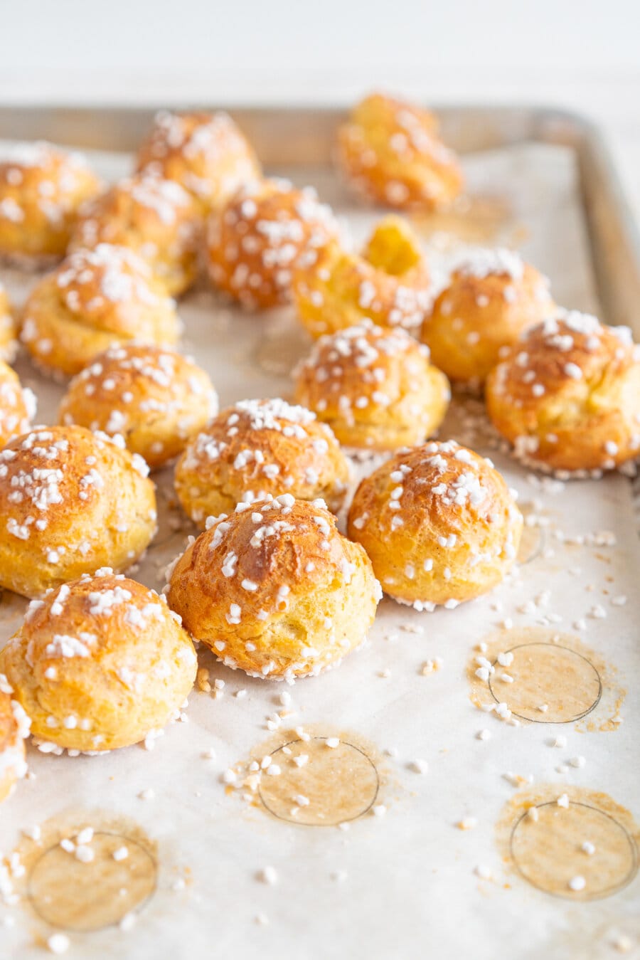 Brown Butter Chouquettes. Chouquettes are little choux pastry bites, piped into rounds and finished with pearl sugar before being baked to golden perfection. Choux is easy to make and is easy to freeze, making these the perfect treat. Brown butter choux has a delicious depth of flavour and is a perfect easy twist on a classic.