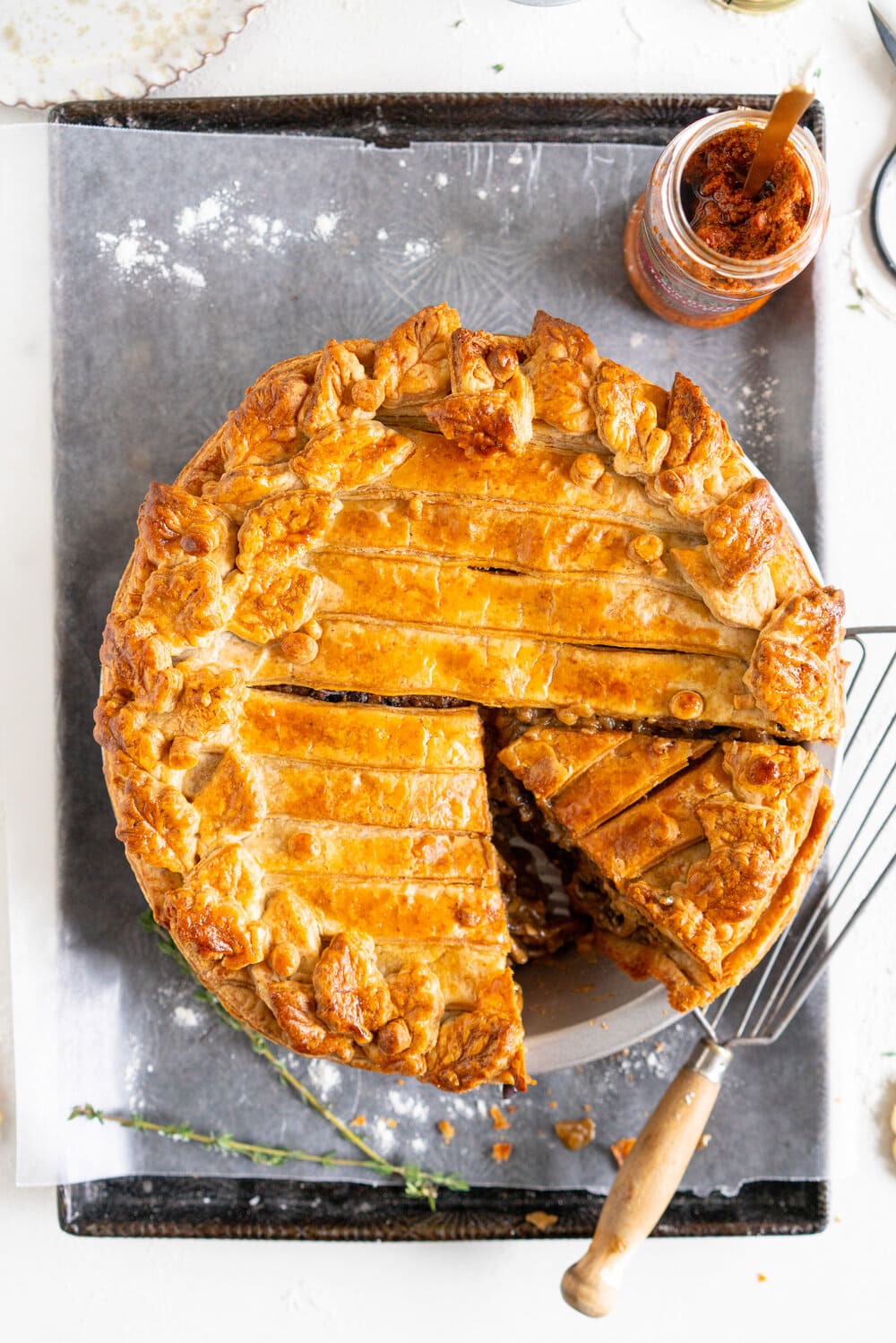 Mushroom and Sundried Tomato Pesto Pie with Parmesan and Black Pepper Crust. A rich, hearty mushroom gravy enriched with sundried tomato pesto is tucked inside a golden brown parmesan and black pepper pie crust. This is a perfect vegetarian take on the classic pot pie, and is ultimate comfort food. Mushroom pot pie will be your next favourite!