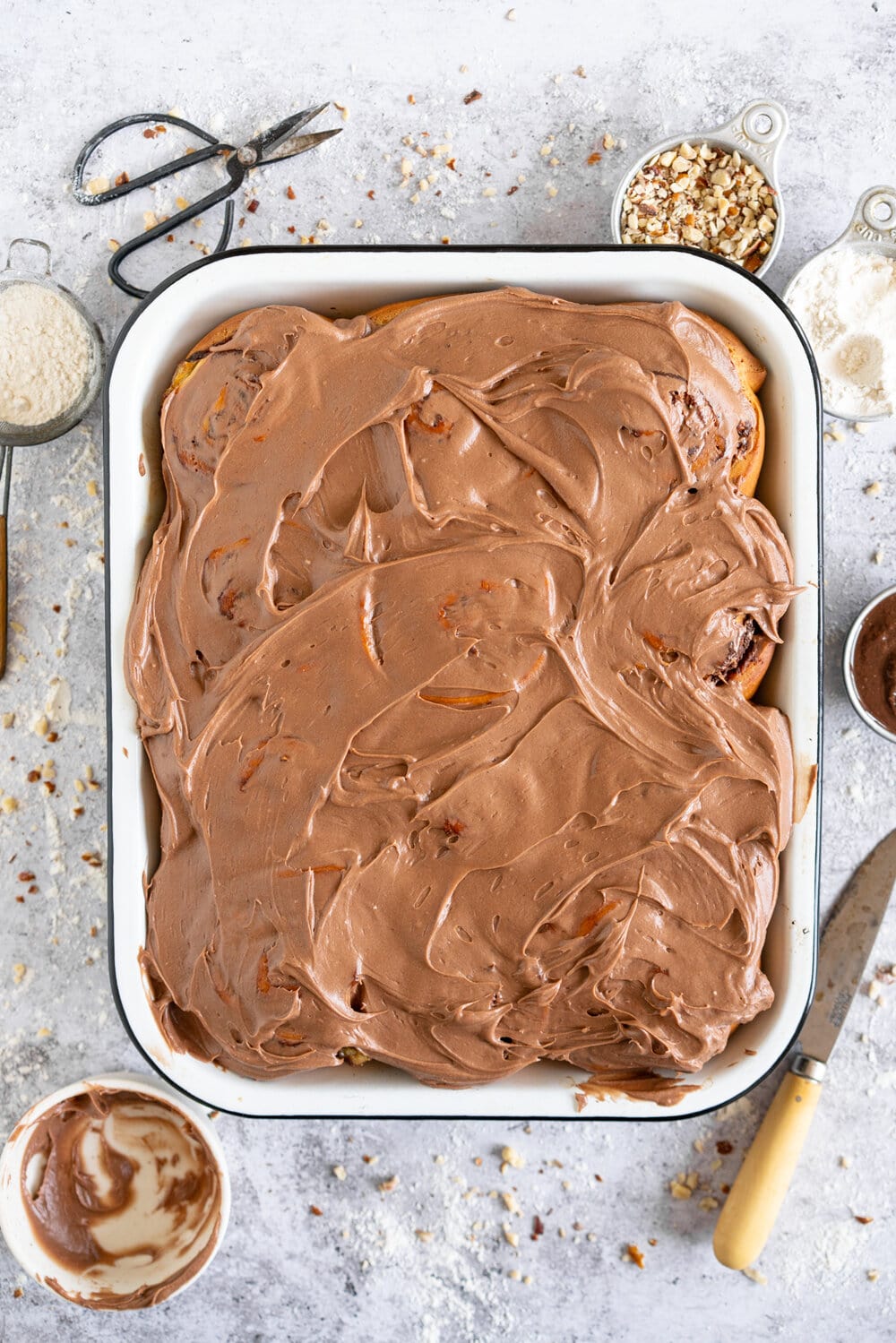 Nutella Banana and Hazelnut Sweet Rolls with Chocolate Cream Cheese Frosting. Soft, fluffy brioche is covered in nutella and bananas and sprinkled with hazelnuts, then rolled up into perfect sweet rolls and finished with a creamy and smooth chocolate cream cheese frosting. These are a great way to use up any extra bananas that you have around!