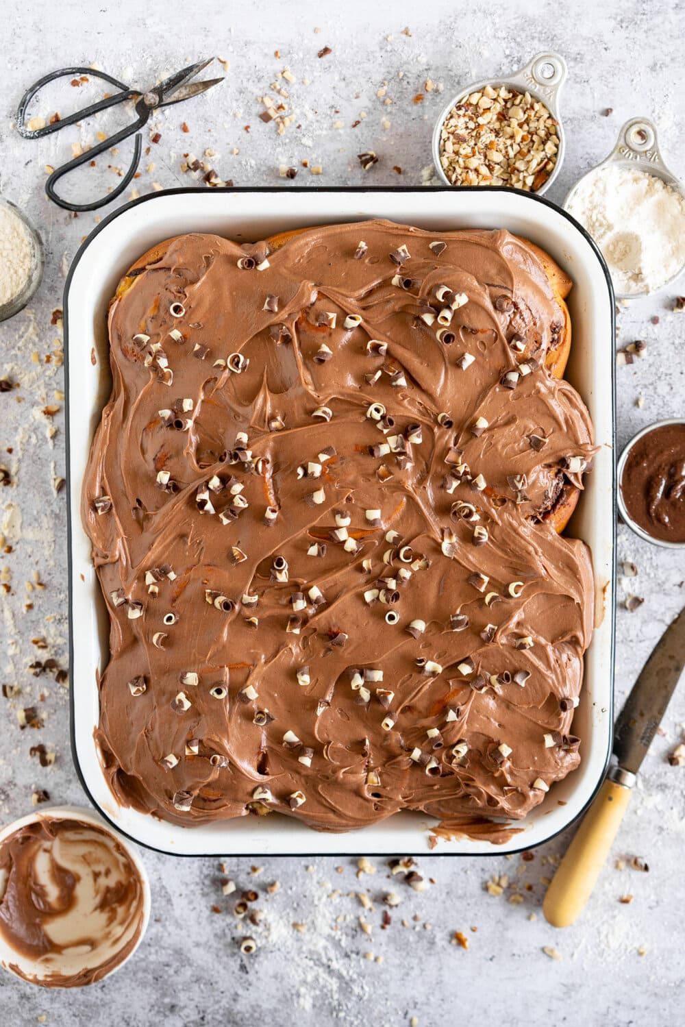 Nutella Banana and Hazelnut Sweet Rolls with Chocolate Cream Cheese Frosting. Soft, fluffy brioche is covered in nutella and bananas and sprinkled with hazelnuts, then rolled up into perfect sweet rolls and finished with a creamy and smooth chocolate cream cheese frosting. These are a great way to use up any extra bananas that you have around!