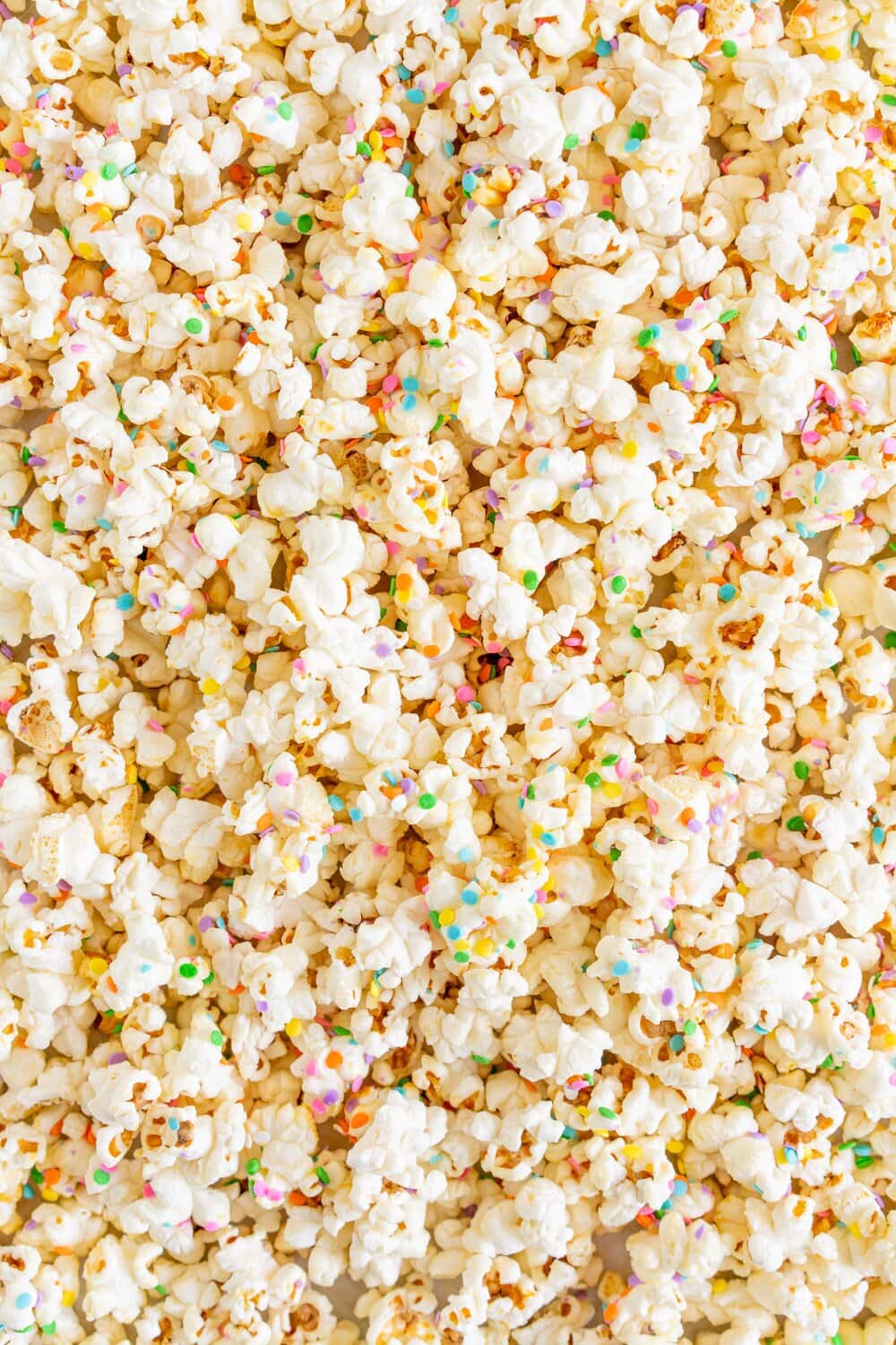 Funfetti Kettle Corn (Sprinkle Kettle Corn) - this sweet, salty snack is the perfect fun treat. Kettle corn is made on the stovetop, and crunchy confetti sprinkles are added for a funfetti twist. This Kettle corn recipe is easy, and is great for making with kids.