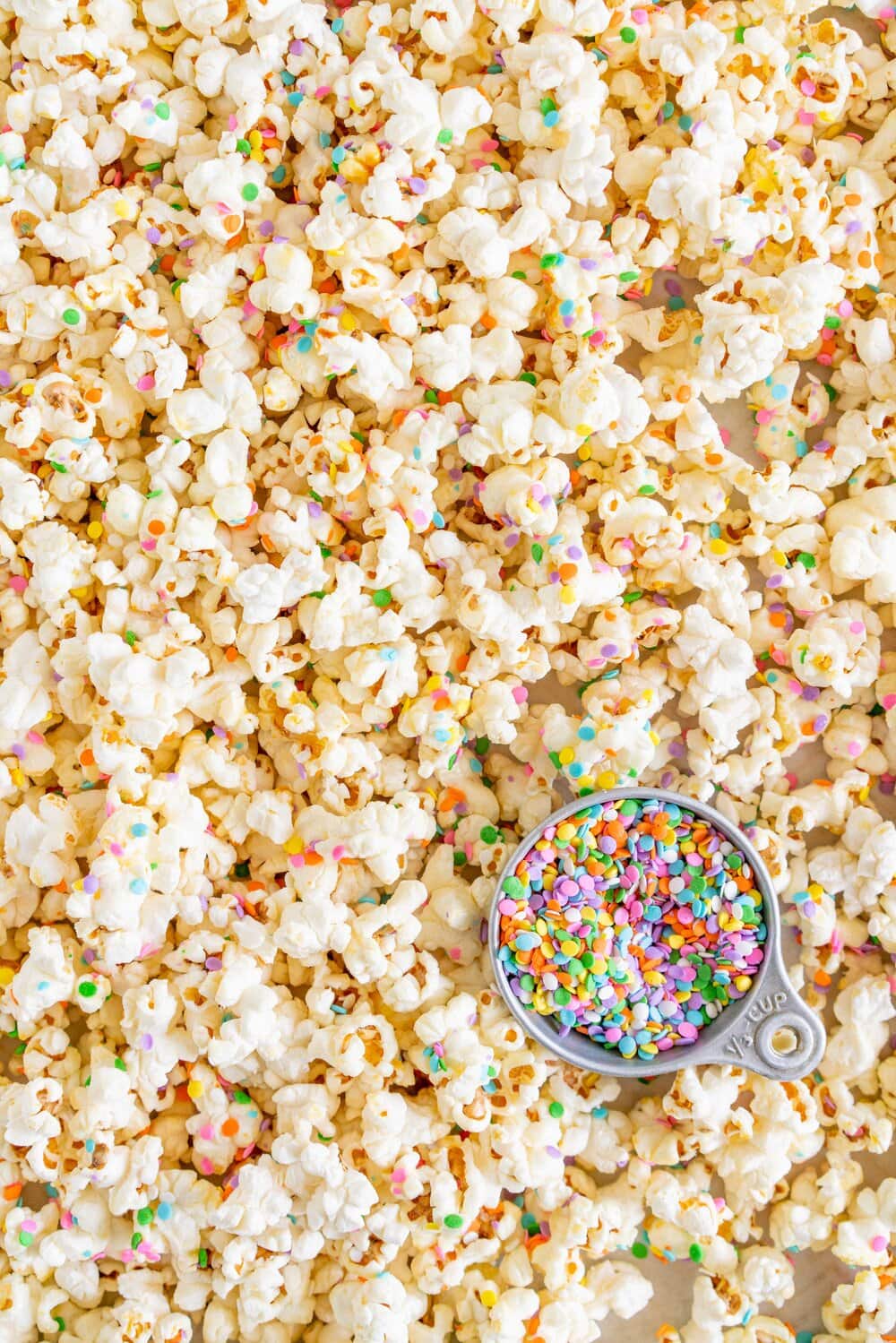 Funfetti Kettle Corn (Sprinkle Kettle Corn) - this sweet, salty snack is the perfect fun treat. Kettle corn is made on the stovetop, and crunchy confetti sprinkles are added for a funfetti twist. This Kettle corn recipe is easy, and is great for making with kids.