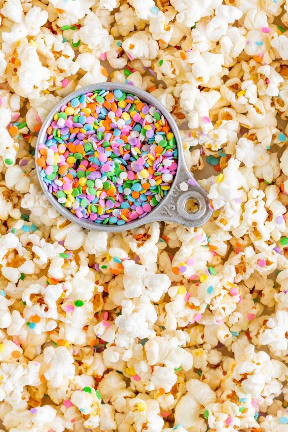 Funfetti Kettle Corn (Sprinkle Kettle Corn) - this sweet, salty snack is the perfect fun treat. Kettle corn is made on the stovetop, and crunchy confetti sprinkles are added for a funfetti twist. This Kettle corn recipe is easy, and is great for making with kids.