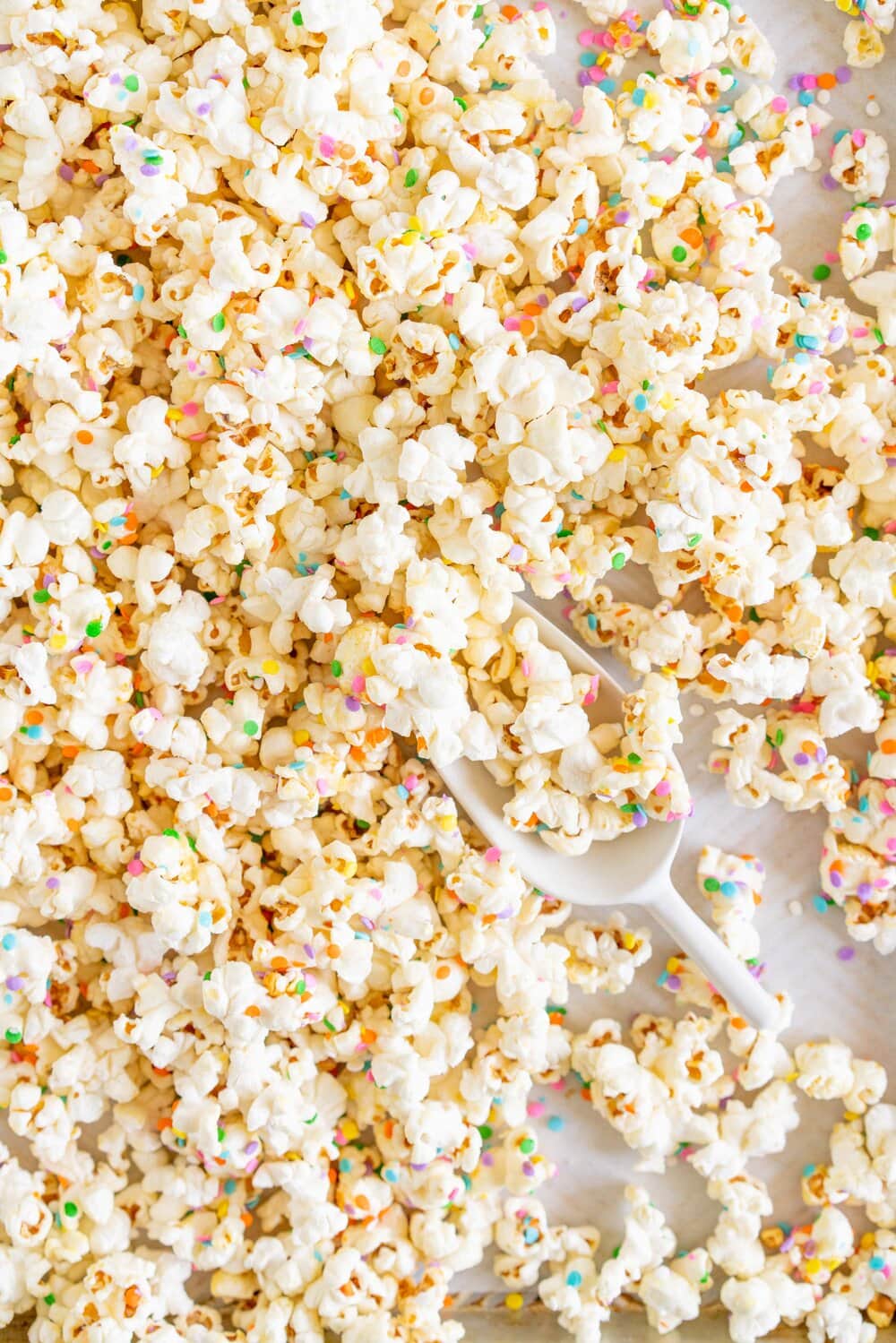 Funfetti Kettle Corn (Sprinkle Kettle Corn) - this sweet, salty snack is the perfect fun treat. Kettle corn is made on the stovetop, and crunchy confetti sprinkles are added for a funfetti twist. This Kettle corn recipe is easy, and is great for making with kids.