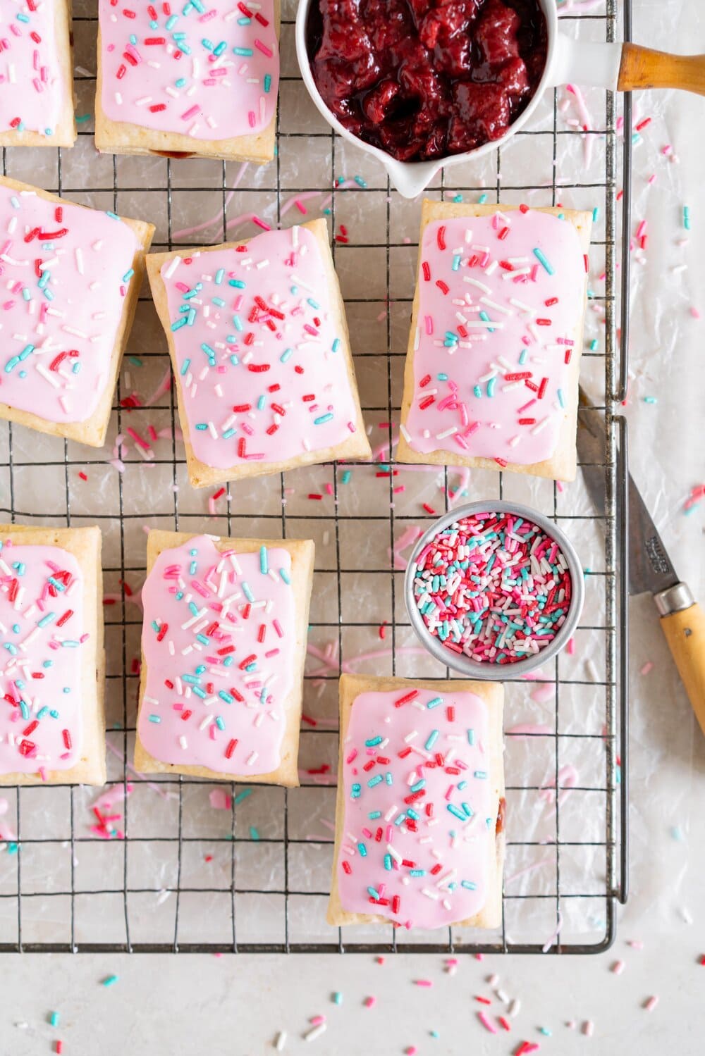Roasted Strawberry and Balsamic Pop tarts. A slow roasted strawberry balsamic jam is used to fill a tender buttery pie dough to make perfect pop tarts, which are finished with a pink royal icing and sprinkles.