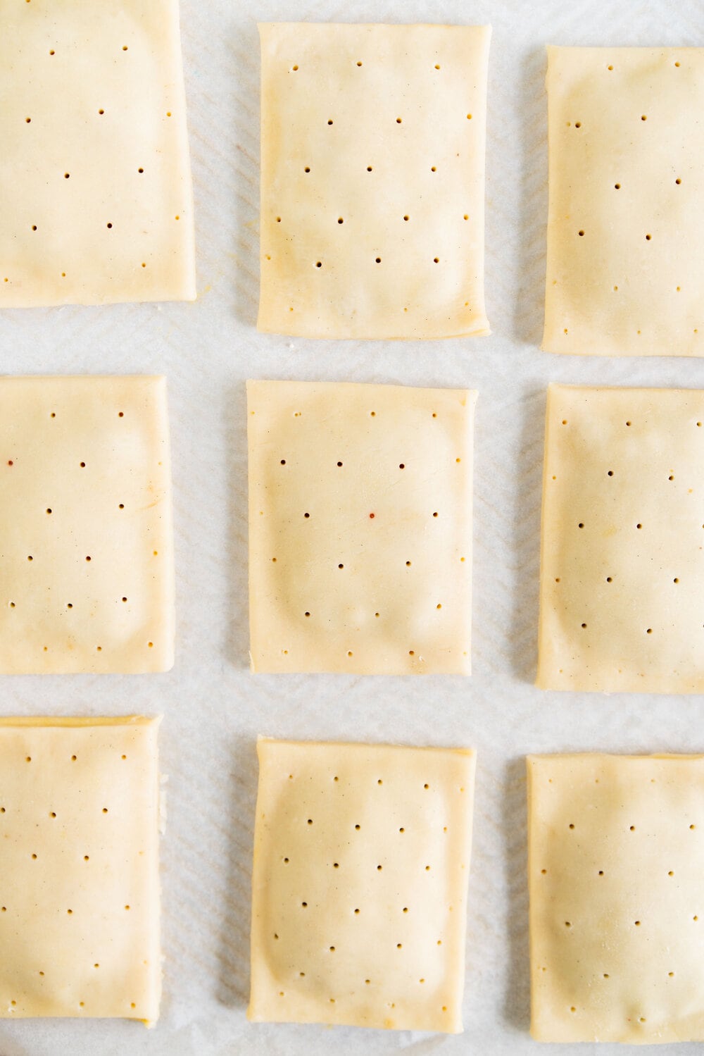 Roasted Strawberry and Balsamic Pop tarts. A slow roasted strawberry balsamic jam is used to fill a tender buttery pie dough to make perfect pop tarts, which are finished with a pink royal icing and sprinkles.