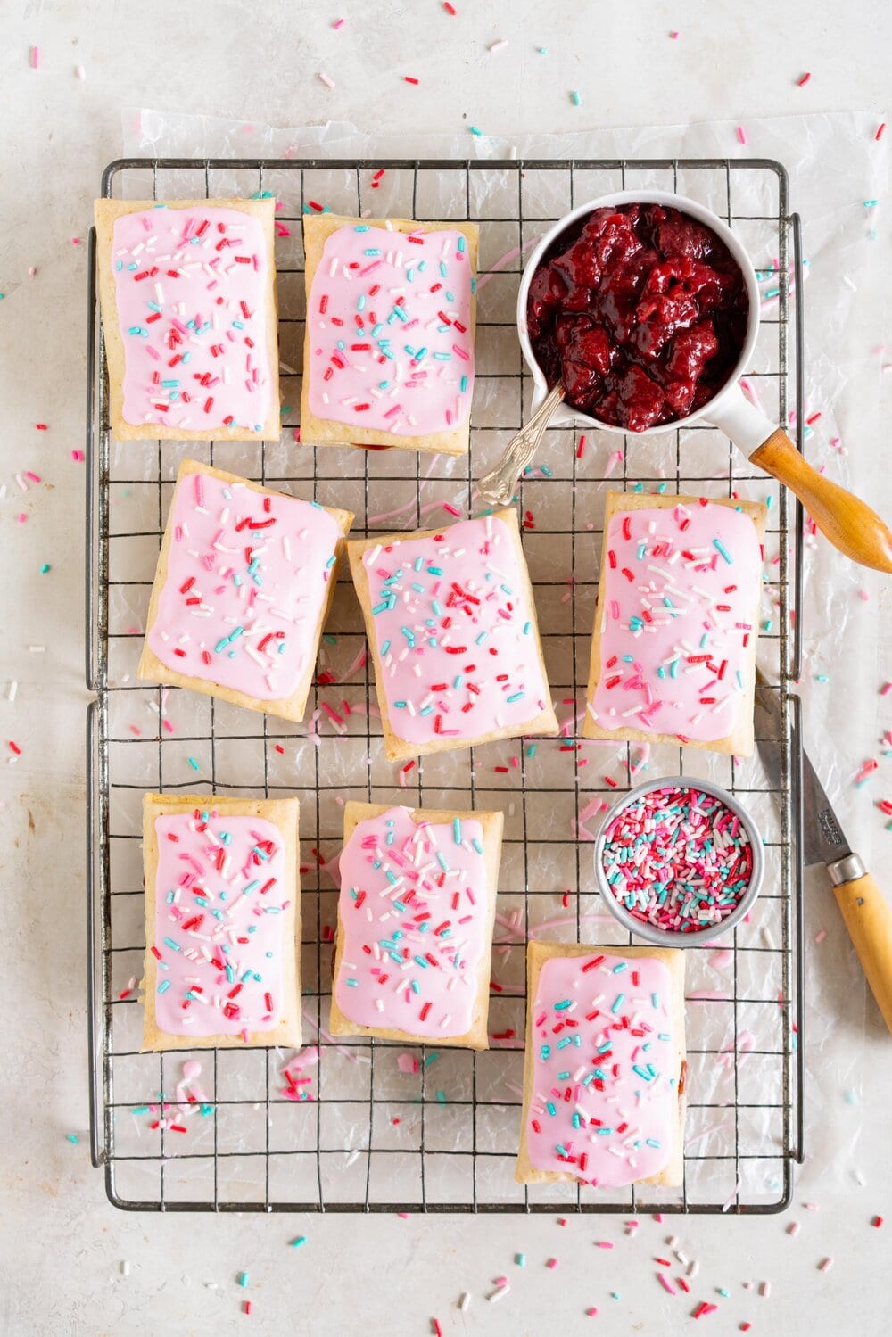 Roasted Strawberry and Balsamic Pop tarts. A slow roasted strawberry balsamic jam is used to fill a tender buttery pie dough to make perfect pop tarts, which are finished with a pink royal icing and sprinkles.
