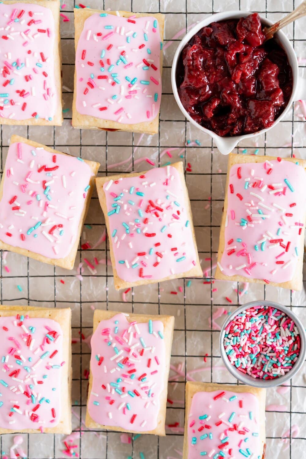 Roasted Strawberry and Balsamic Pop tarts. A slow roasted strawberry balsamic jam is used to fill a tender buttery pie dough to make perfect pop tarts, which are finished with a pink royal icing and sprinkles.