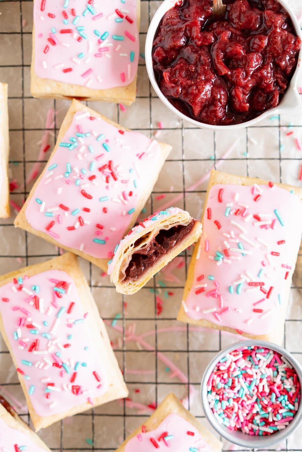 Roasted Strawberry and Balsamic Pop tarts. A slow roasted strawberry balsamic jam is used to fill a tender buttery pie dough to make perfect pop tarts, which are finished with a pink royal icing and sprinkles.