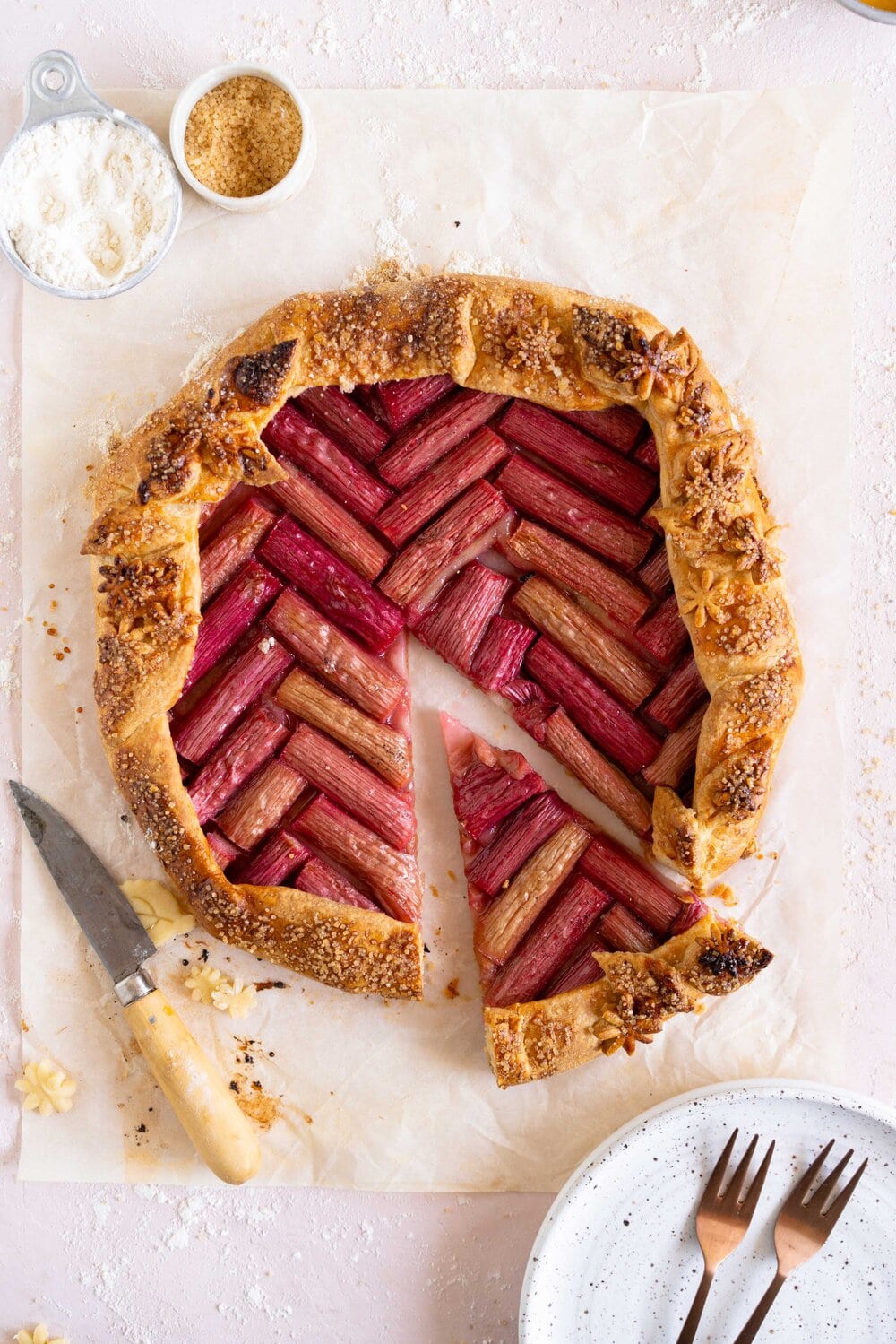 Rhubarb galette with a cornmeal crust. This easy rhubarb galette has a toasty cornmeal crust and a beautiful herringbone pattern. This galette is an easy spring dessert and is the perfect way to bake with rhubarb.