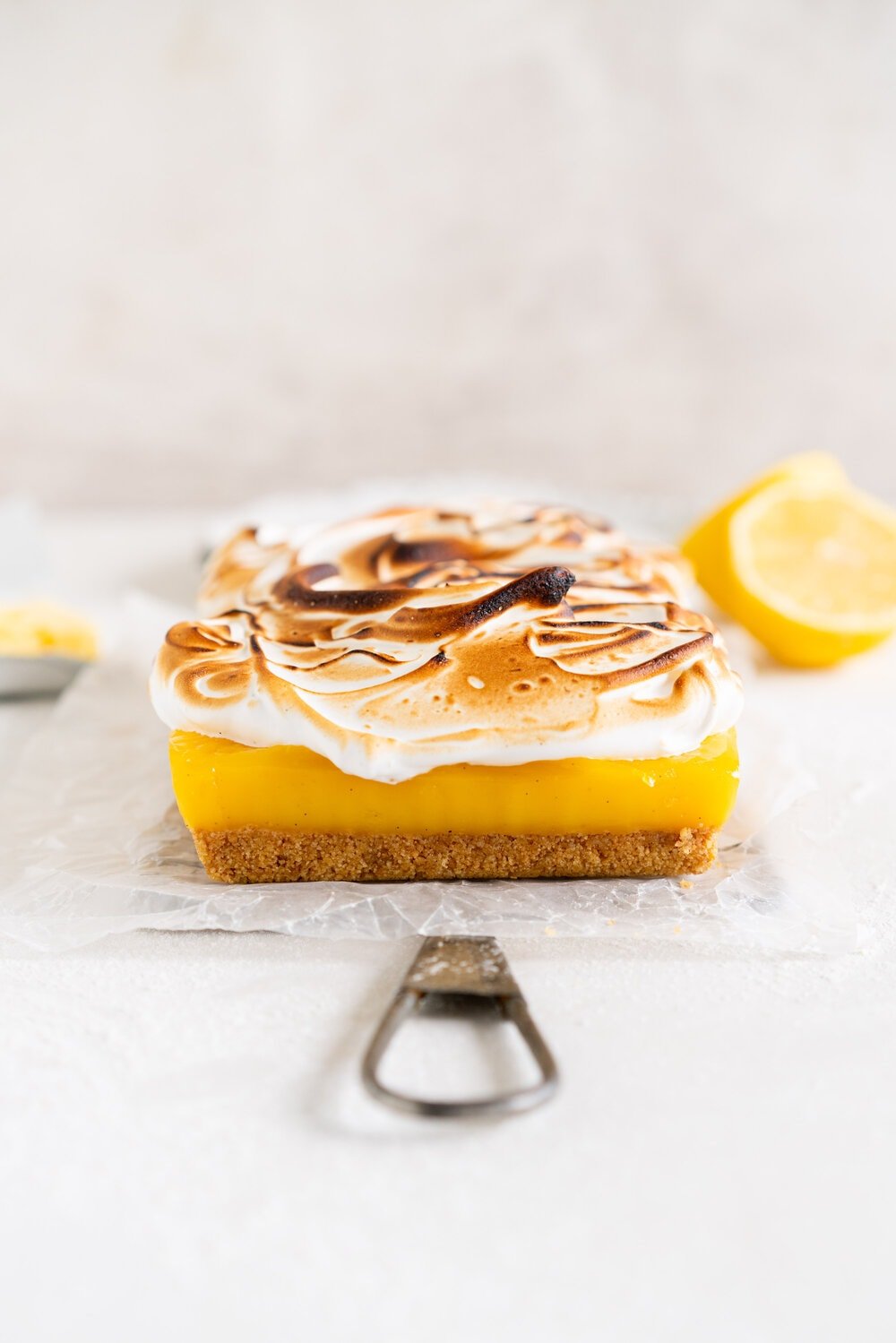 Small Batch No-Bake Passionfruit and Lemon Meringue Bars. A buttery graham crust is topped with a smooth lemon and passionfruit filling, and topped with a torched Swiss meringue. These lemon and passionfruit bars are easy to make and do not need an oven, making them the perfect summer dessert!