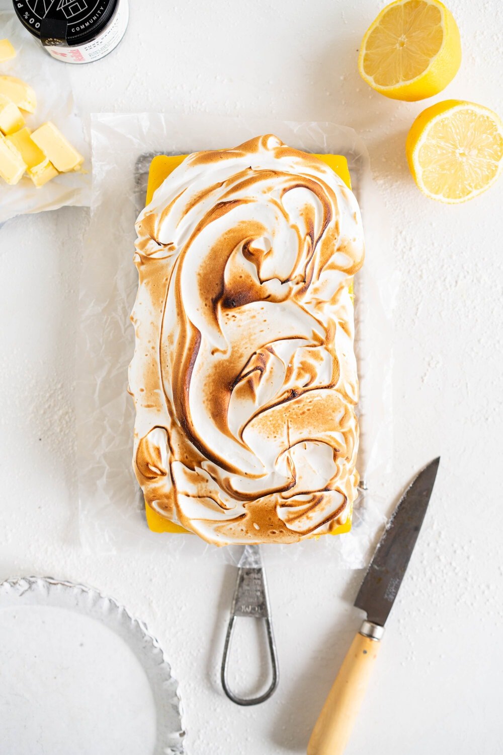 Small Batch No-Bake Passionfruit and Lemon Meringue Bars. A buttery graham crust is topped with a smooth lemon and passionfruit filling, and topped with a torched Swiss meringue. These lemon and passionfruit bars are easy to make and do not need an oven, making them the perfect summer dessert!