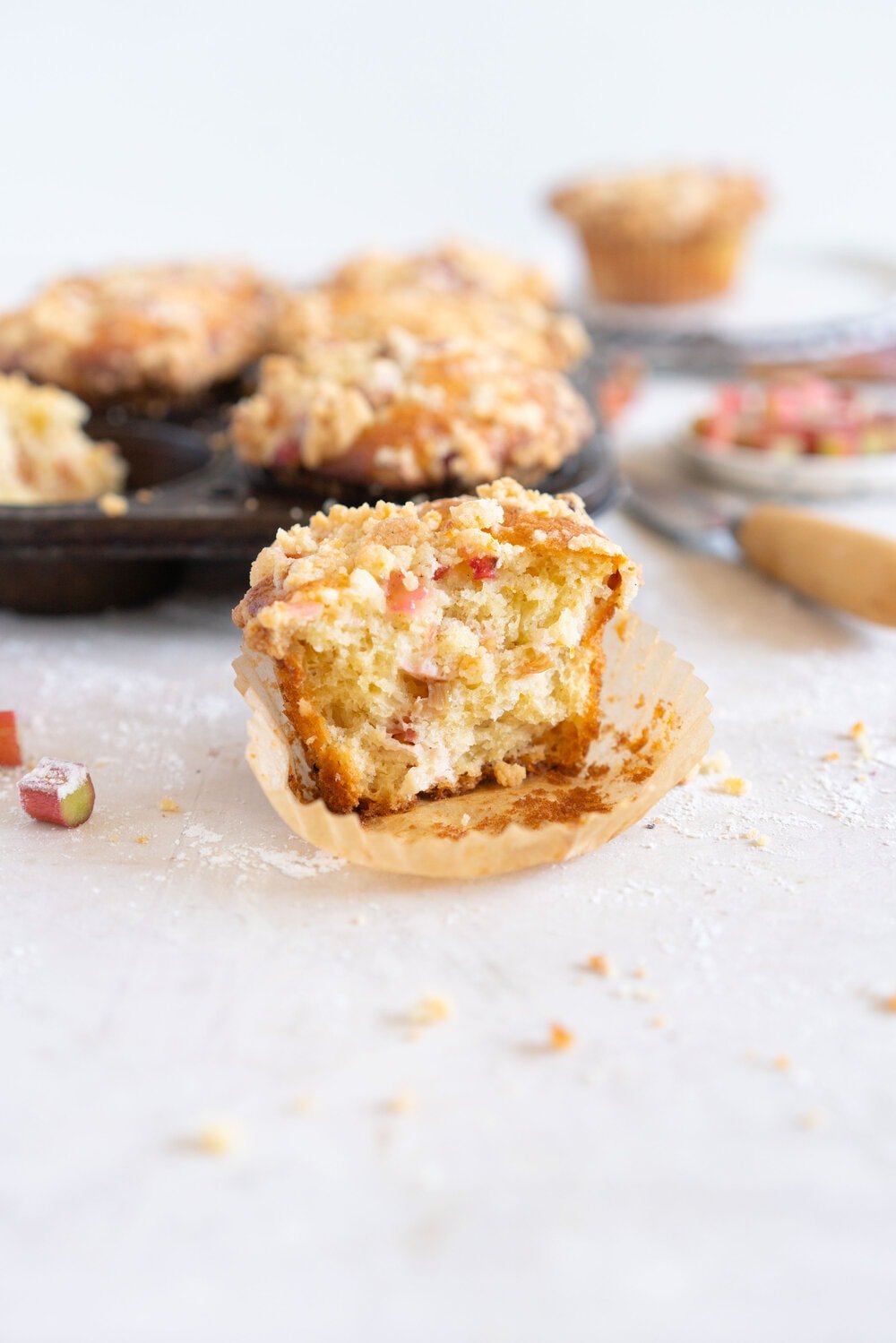 Rhubarb Streusel Muffins - a moist muffin base is studded with fresh rhubarb chunks and topped with a crunchy streusel crumble topping which is lightly flavoured with lemon zest and vanilla. This easy streusel muffin recipe can be made with any fruit but is perfect made with fresh rhubarb.