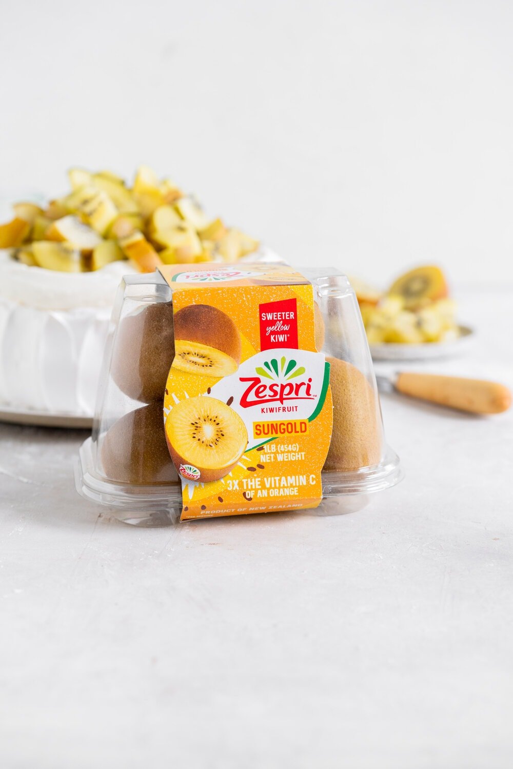 The most perfect, easy pavlova recipe. Using Swiss Meringue instead of the traditional French, this pavlova recipe is crispy on the outside and has a perfect, full, marshmallow center, and is much more stable so is resistant to humidity and changes in weather. It is easy to make and the perfect crowd pleaser. This is the most perfect year round dessert. Topped with Manuka Honey whipped cream and golden kiwifruit, this is a New Zealand classic.