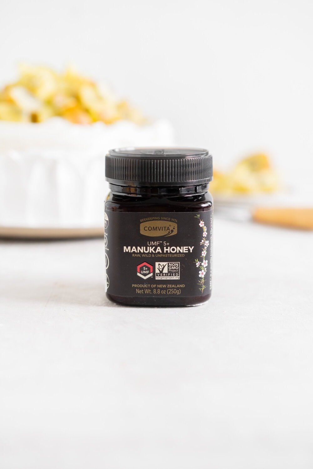 The most perfect, easy pavlova recipe. Using Swiss Meringue instead of the traditional French, this pavlova recipe is crispy on the outside and has a perfect, full, marshmallow center, and is much more stable so is resistant to humidity and changes in weather. It is easy to make and the perfect crowd pleaser. This is the most perfect year round dessert. Topped with Manuka Honey whipped cream and golden kiwifruit, this is a New Zealand classic.