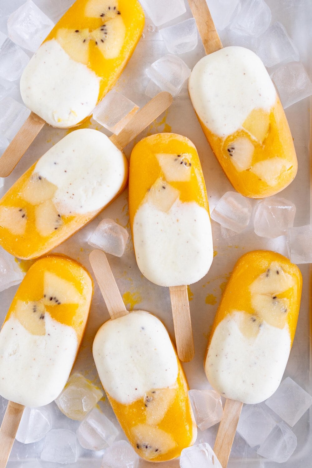 Kiwifruit and Mango Popsicles. Creamy Kiwifruit whipped cream and smooth mango puree are combined into this perfect popsicle. These pops are gluten free and super refreshing, and are great for using up summer fruit. There is no cooking required - simply blend up your fruit and you are ready to go!