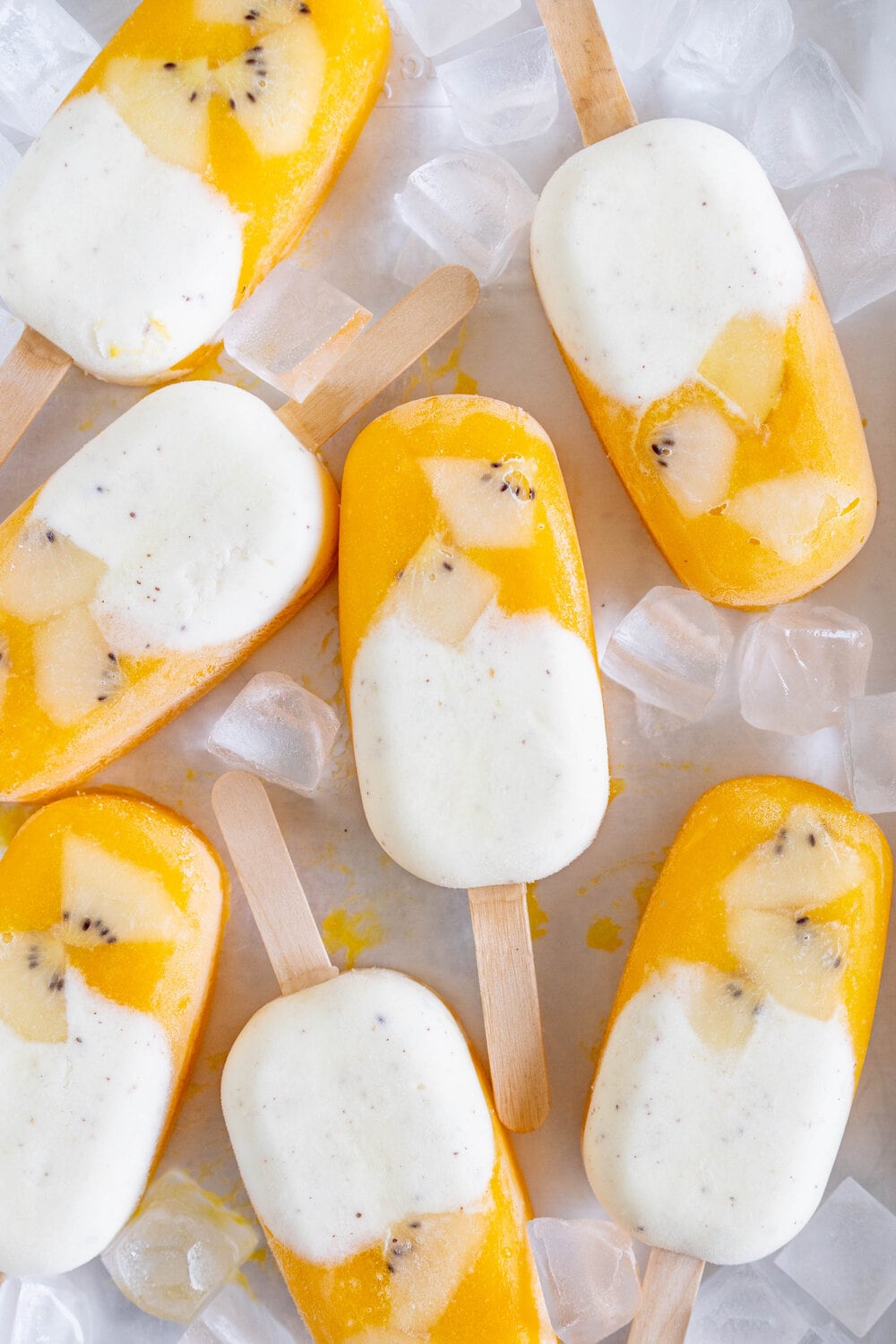 Kiwifruit and Mango Popsicles. Creamy Kiwifruit whipped cream and smooth mango puree are combined into this perfect popsicle. These pops are gluten free and super refreshing, and are great for using up summer fruit. There is no cooking required - simply blend up your fruit and you are ready to go!