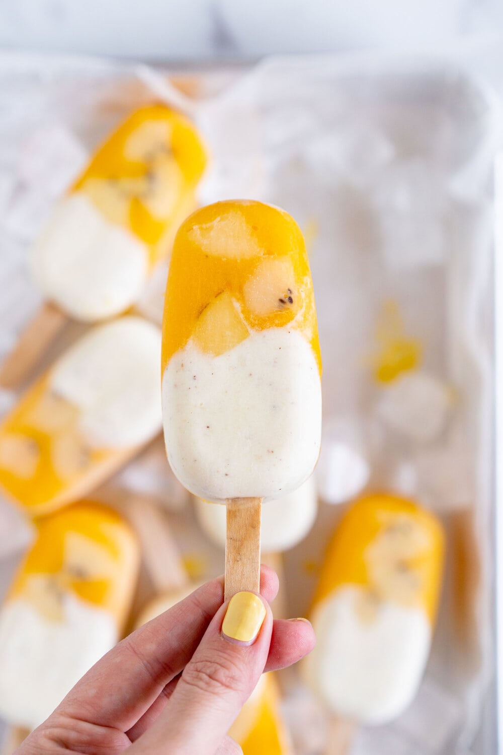Kiwifruit and Mango Popsicles. Creamy Kiwifruit whipped cream and smooth mango puree are combined into this perfect popsicle. These pops are gluten free and super refreshing, and are great for using up summer fruit. There is no cooking required - simply blend up your fruit and you are ready to go!
