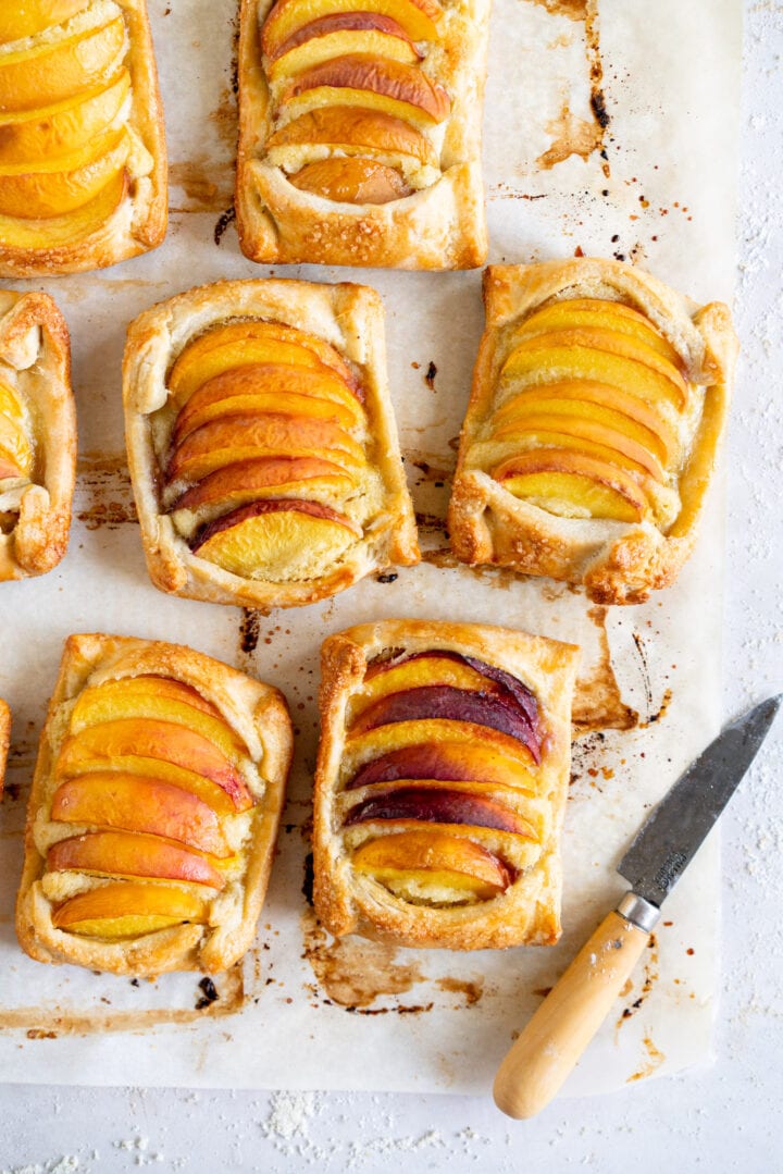 Baked peach galettes with knife