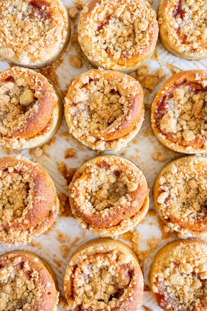 Baked Apricot Crumb Buns topped with Streusel on a baking sheet