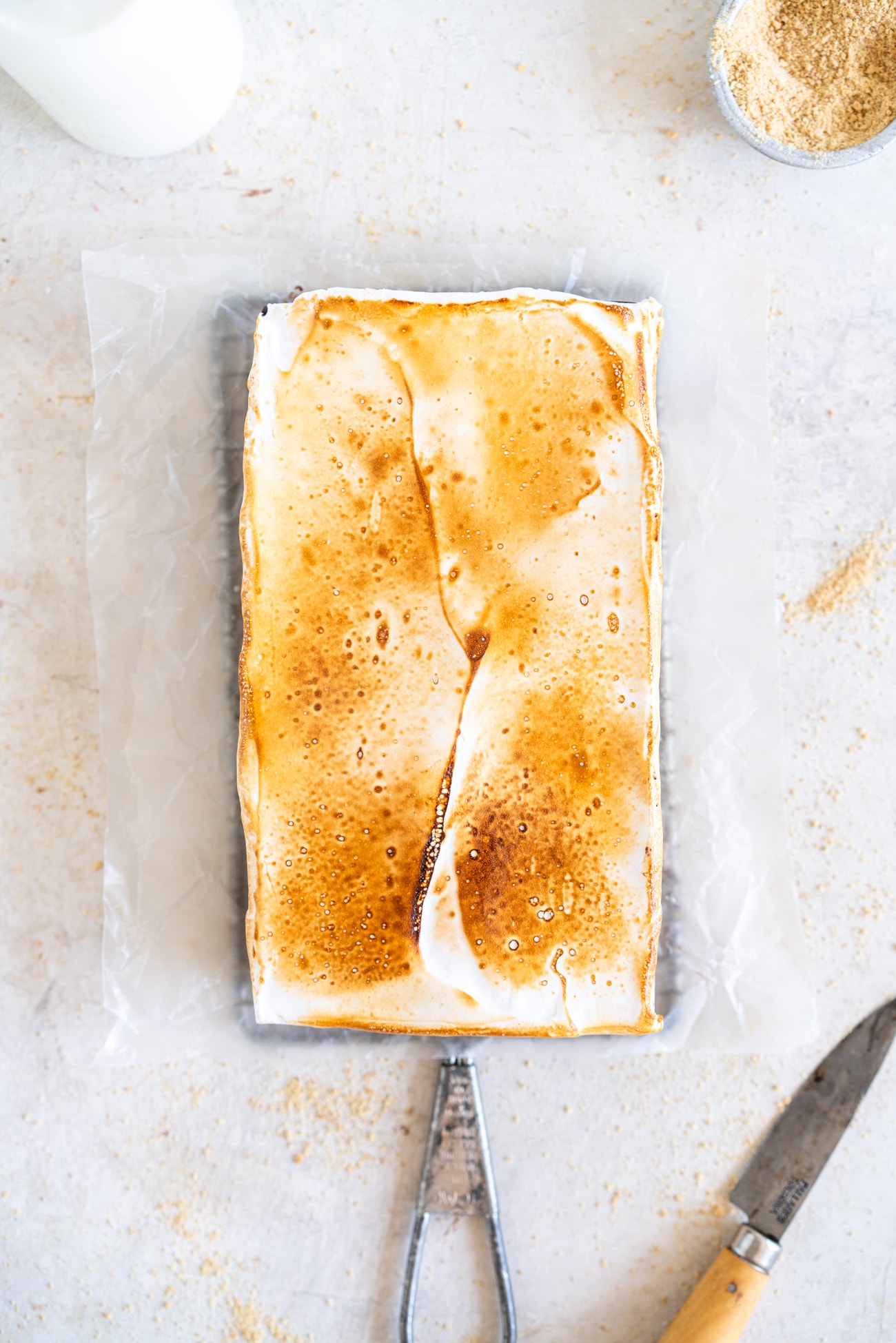 Top down shot of s'mores bar with taosted marshmallow