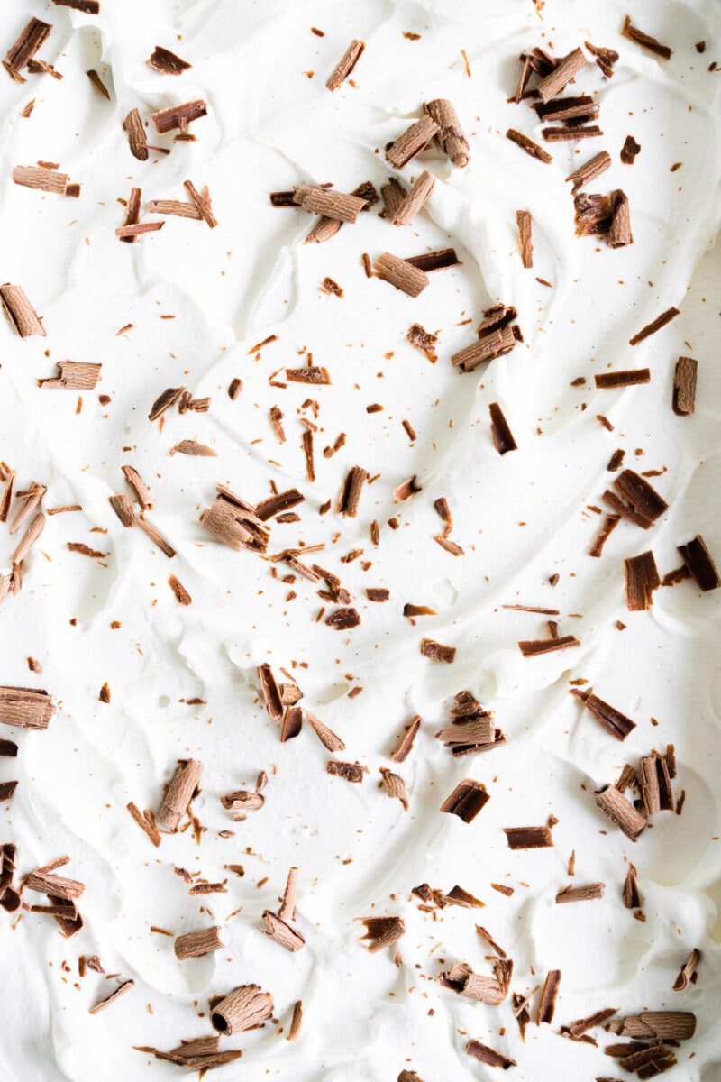 Swoops of whipped cream with chocolate curls