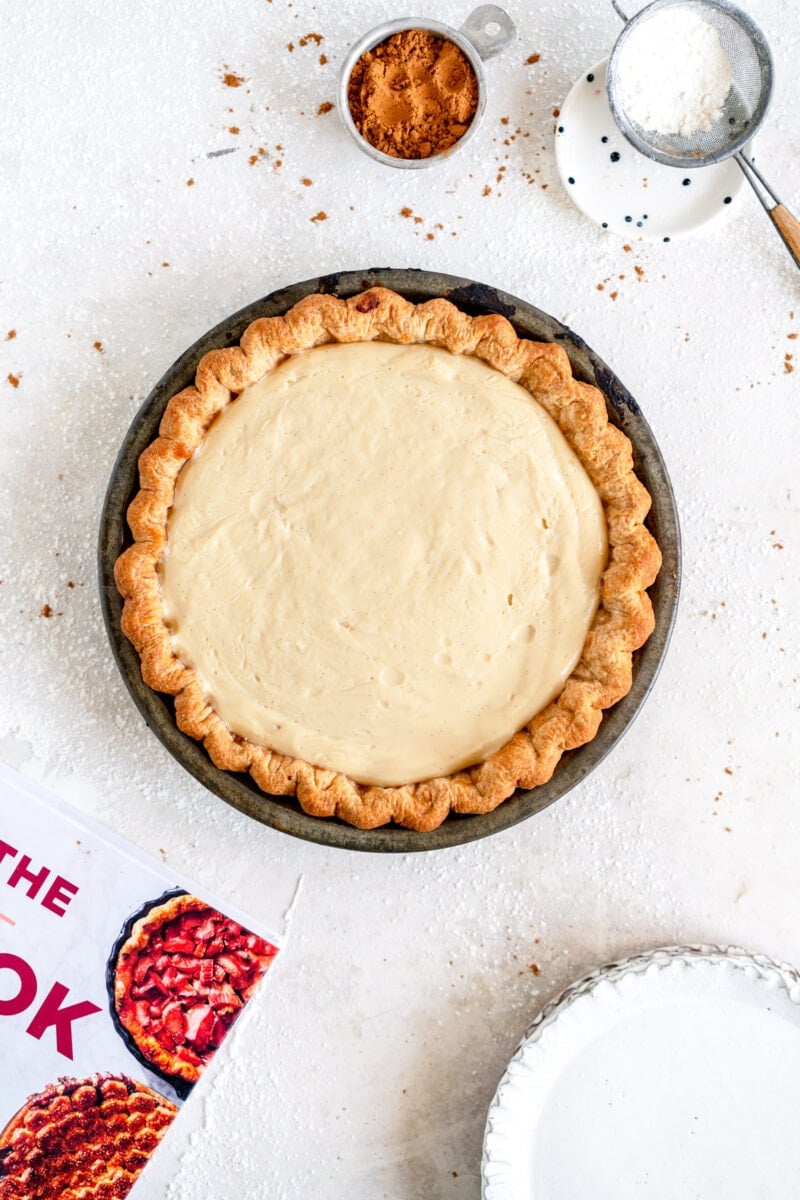 Top down shot of pie with butterscotch pudding layer showing
