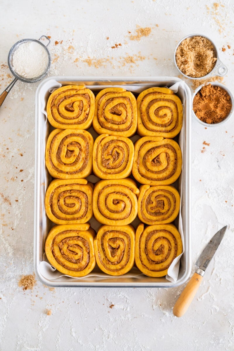 pulled back shot of pumpkin cinnamon rolls