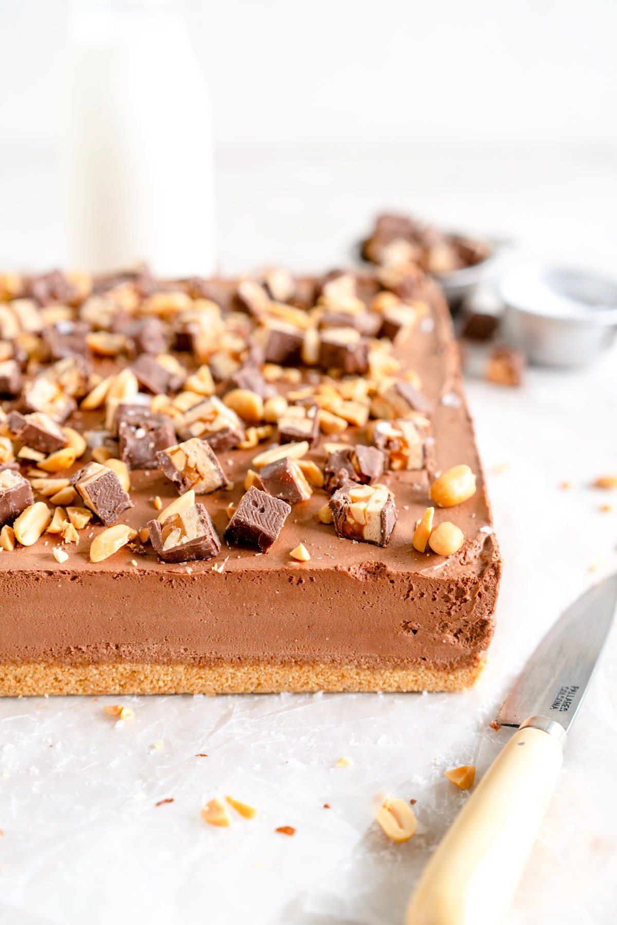 chocolate cheesecake out of pan and ready to serve with knife