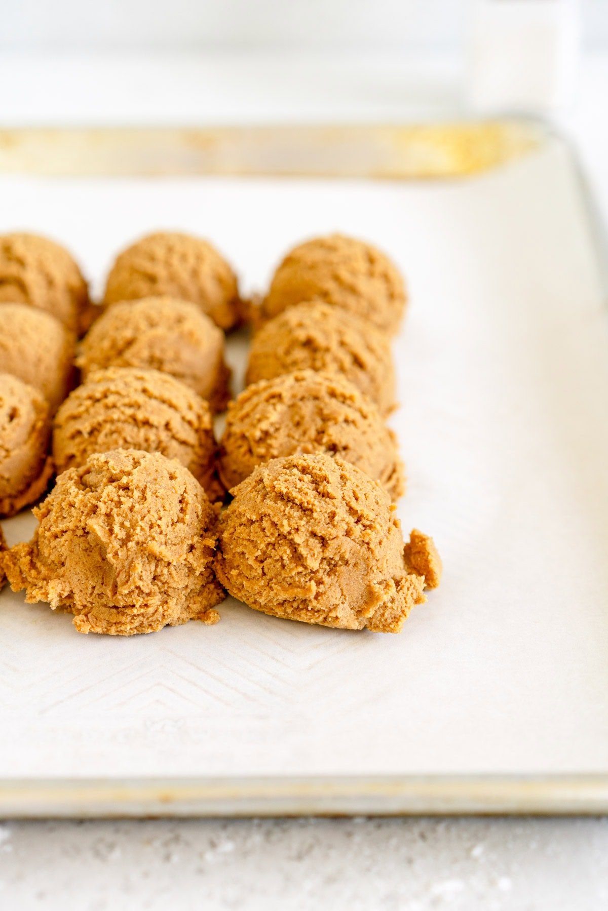 scooped ginger molasses cookie dough