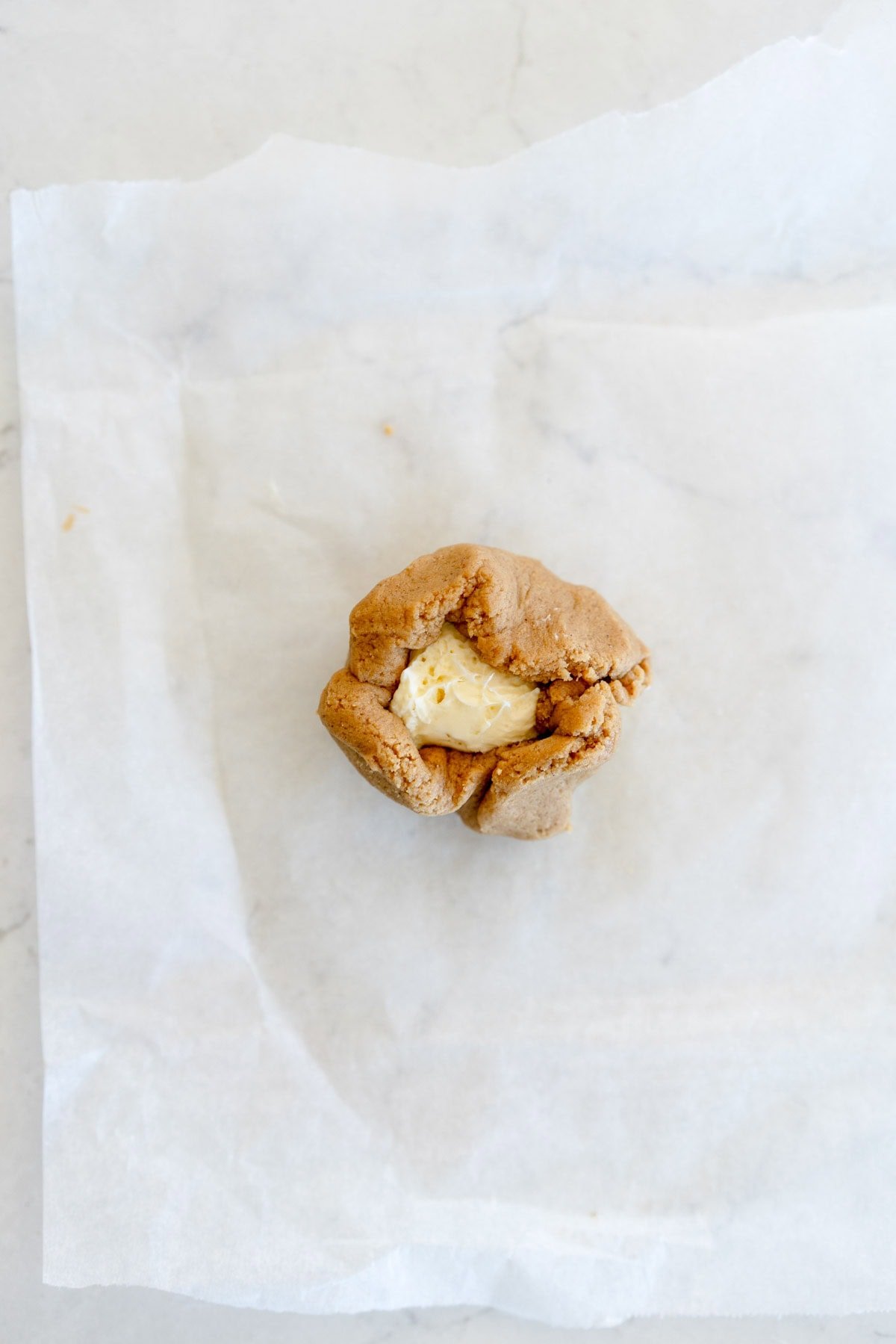 enclose cream cheese filling in cookie dough