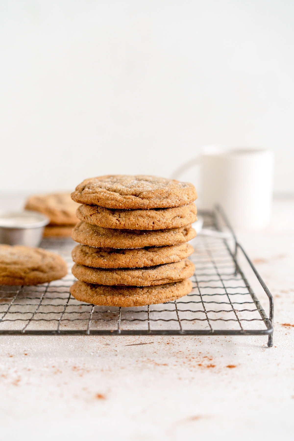 ginger molasses cookies stacked on rack