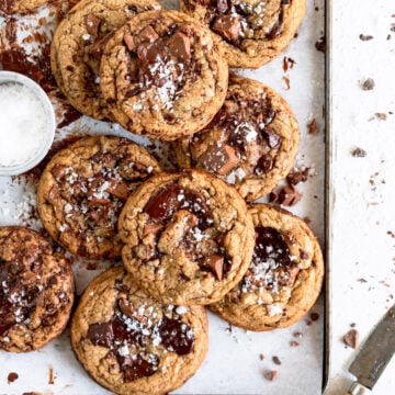 stacked small batch chocolate chip cookies on pan