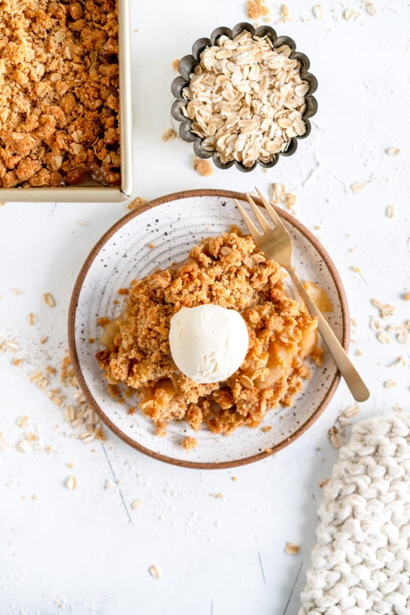 apple crumble on plate with ice cream