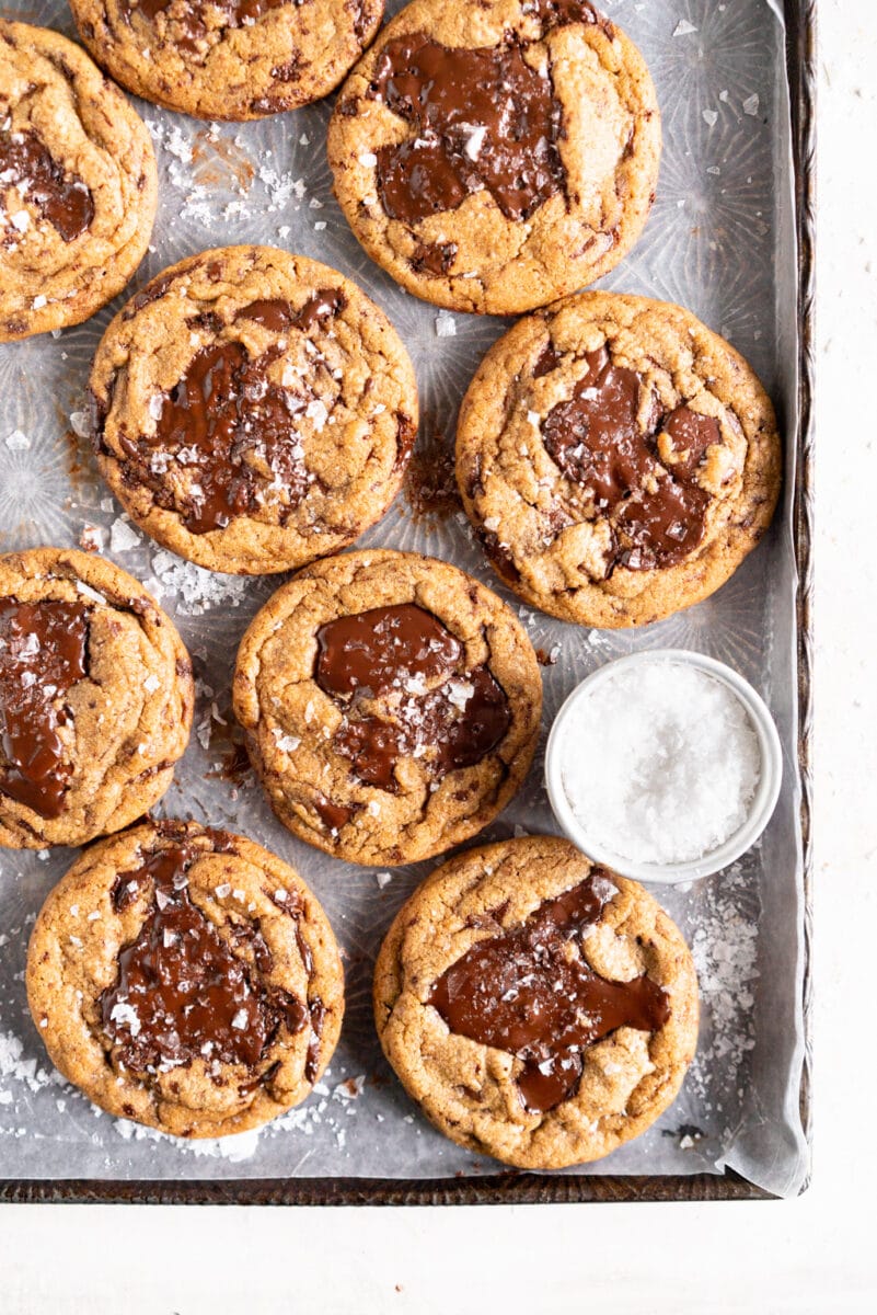 cookies with chocolate puddles on sheet pan