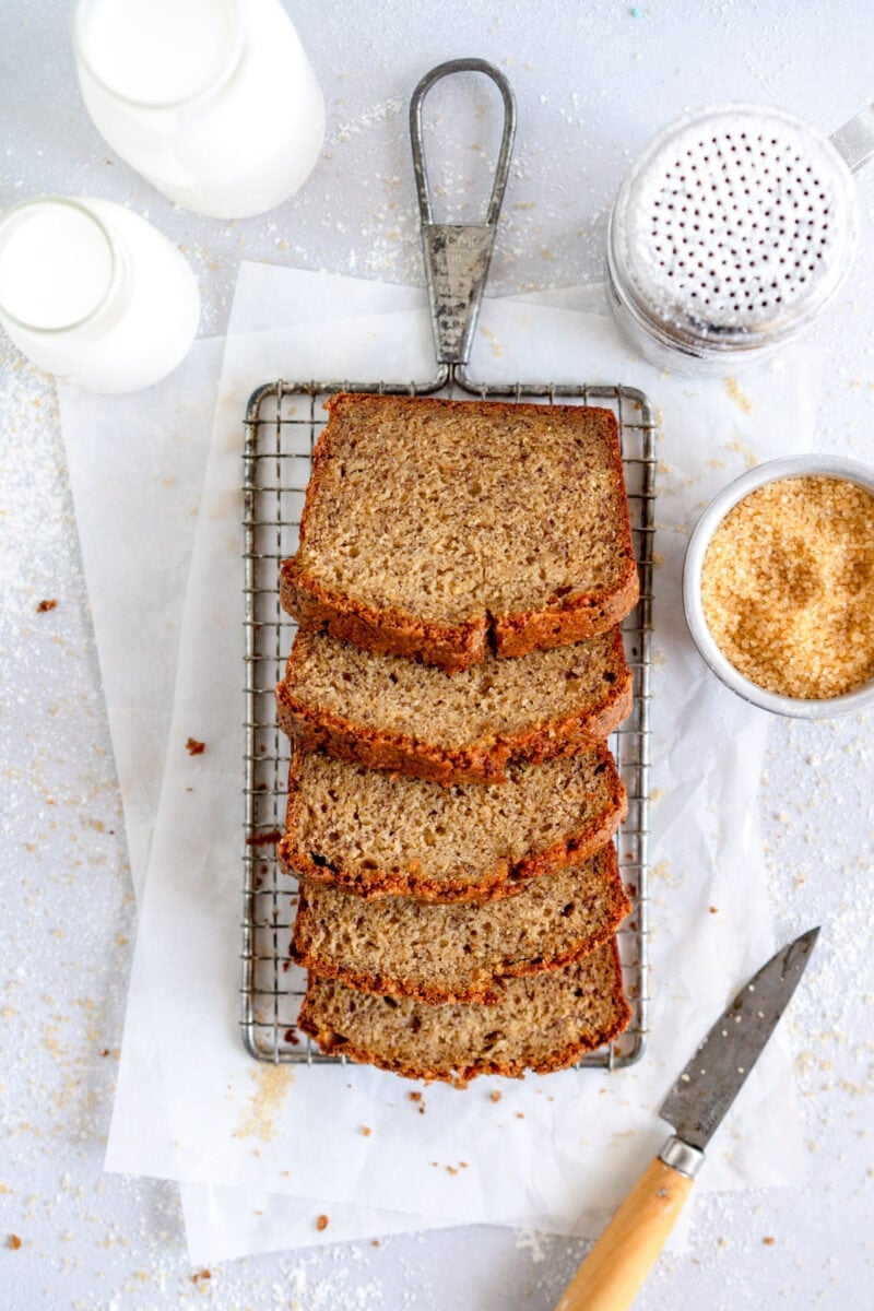 Sliced banana bread on rack
