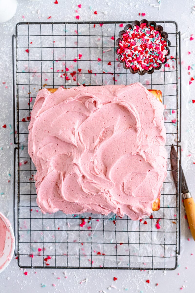 funfetti snack cake on wire rack with frosting