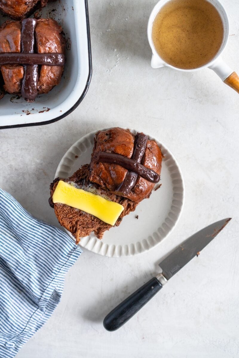 chocolate hot cross bun with butter