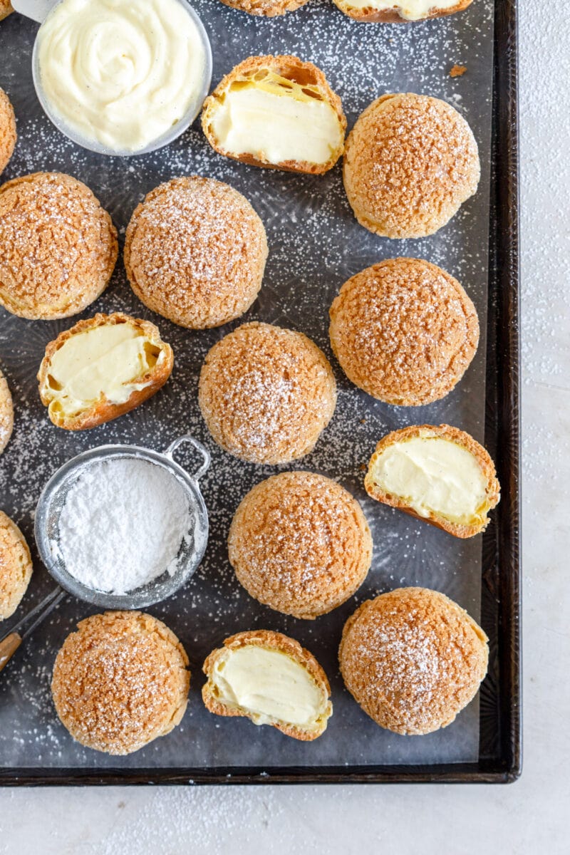 filled cream puffs on sheet pan