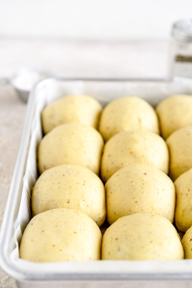angle shot of risen pesto buns
