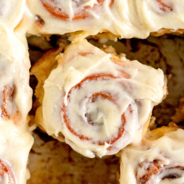 close up of roll with cream cheese frosting
