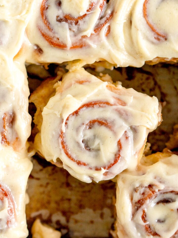 close up of roll with cream cheese frosting