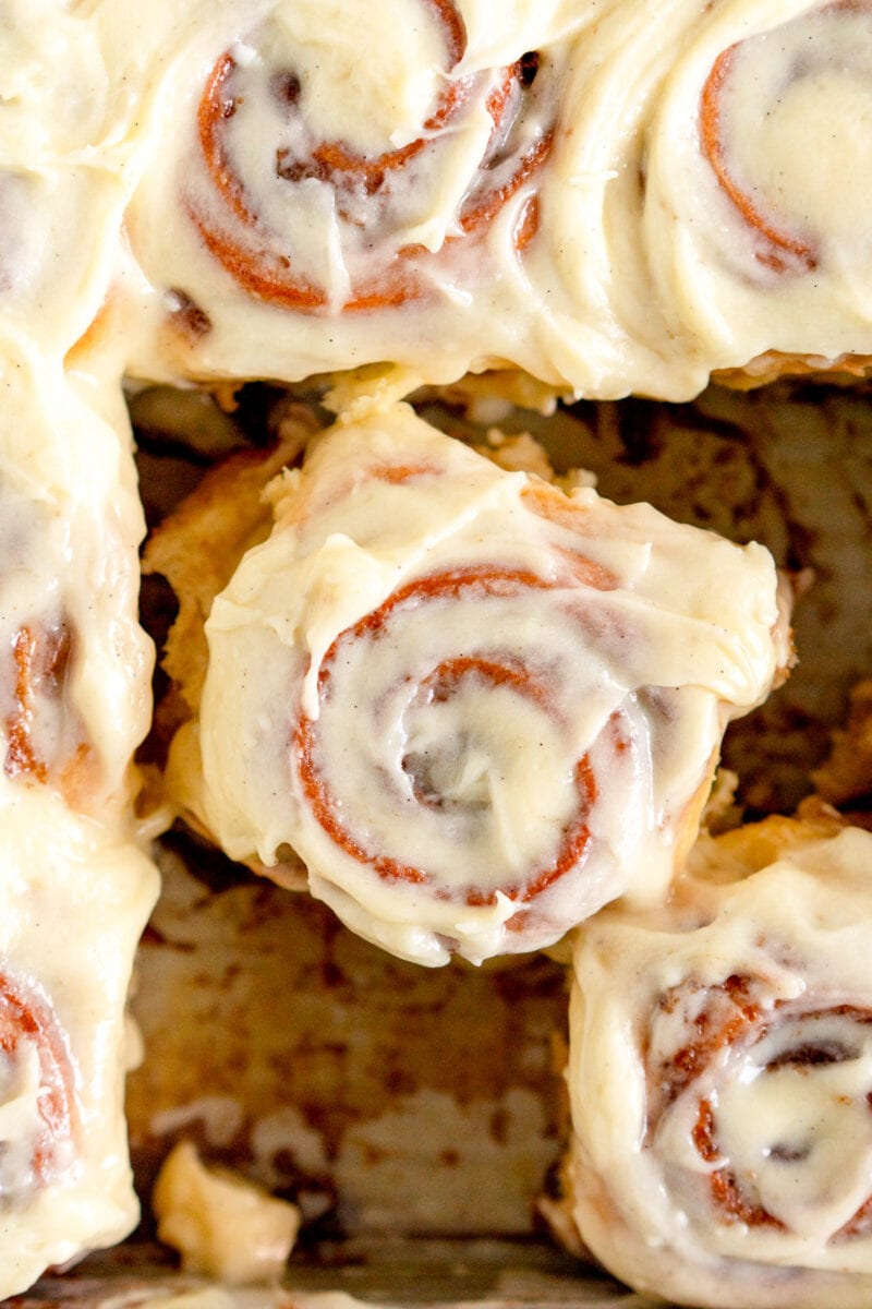 close up of roll with cream cheese frosting