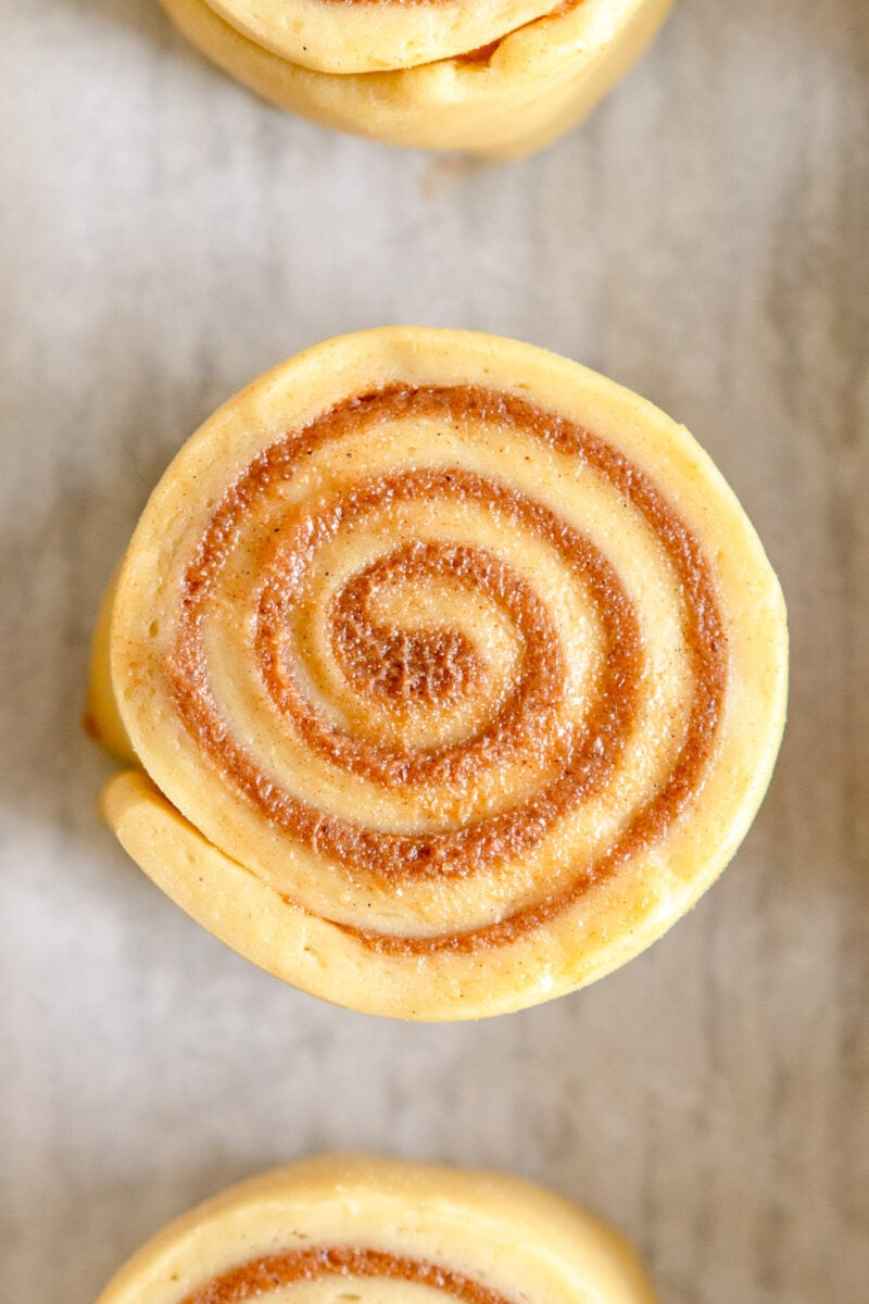 single cinnamon roll ready to be baked